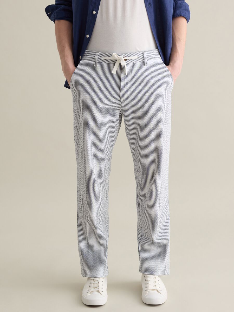 Seersucker chino trousers with white and blue stripes_1