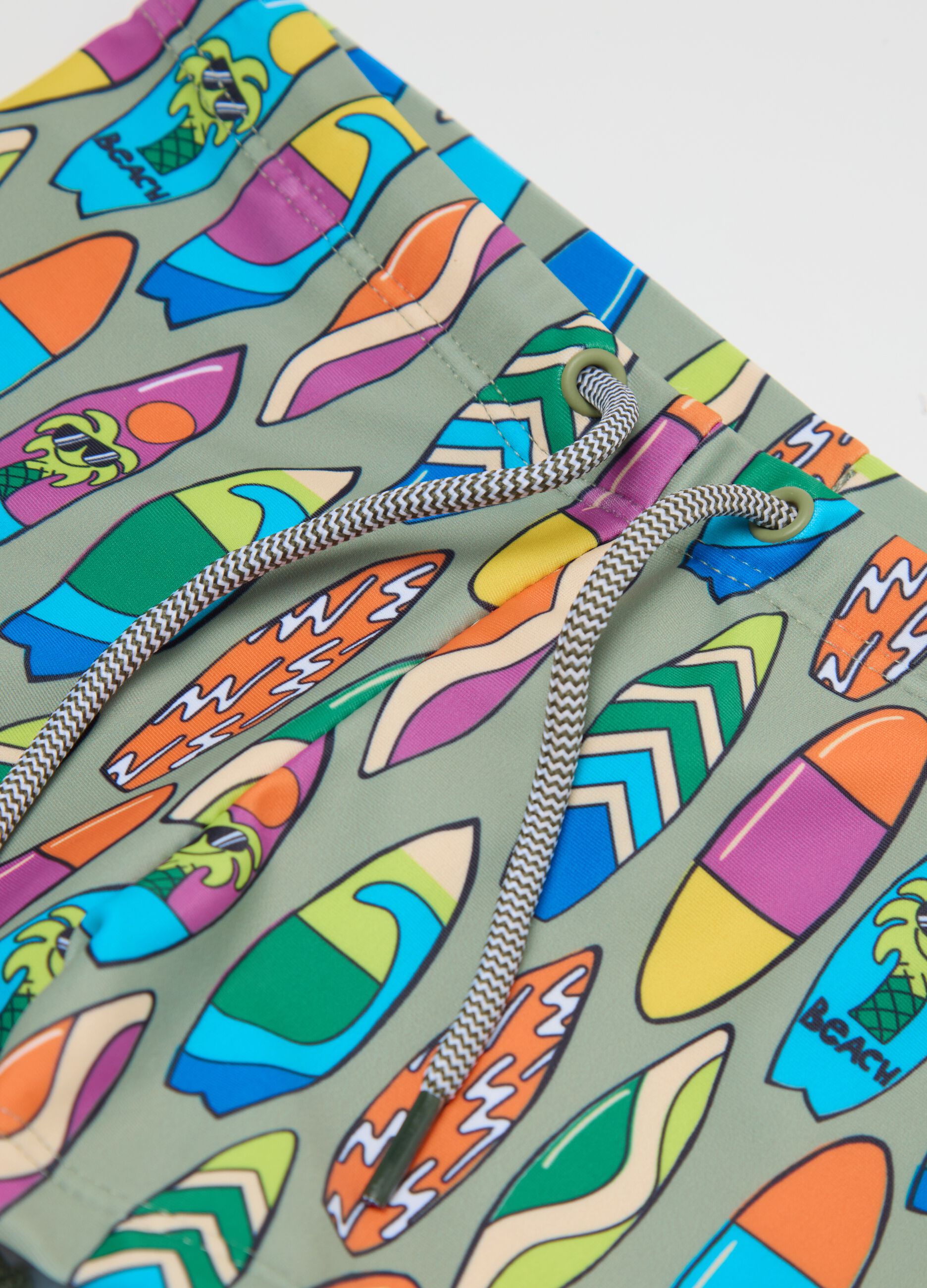 Boys’ swim briefs in multicoloured stretch fabric with print