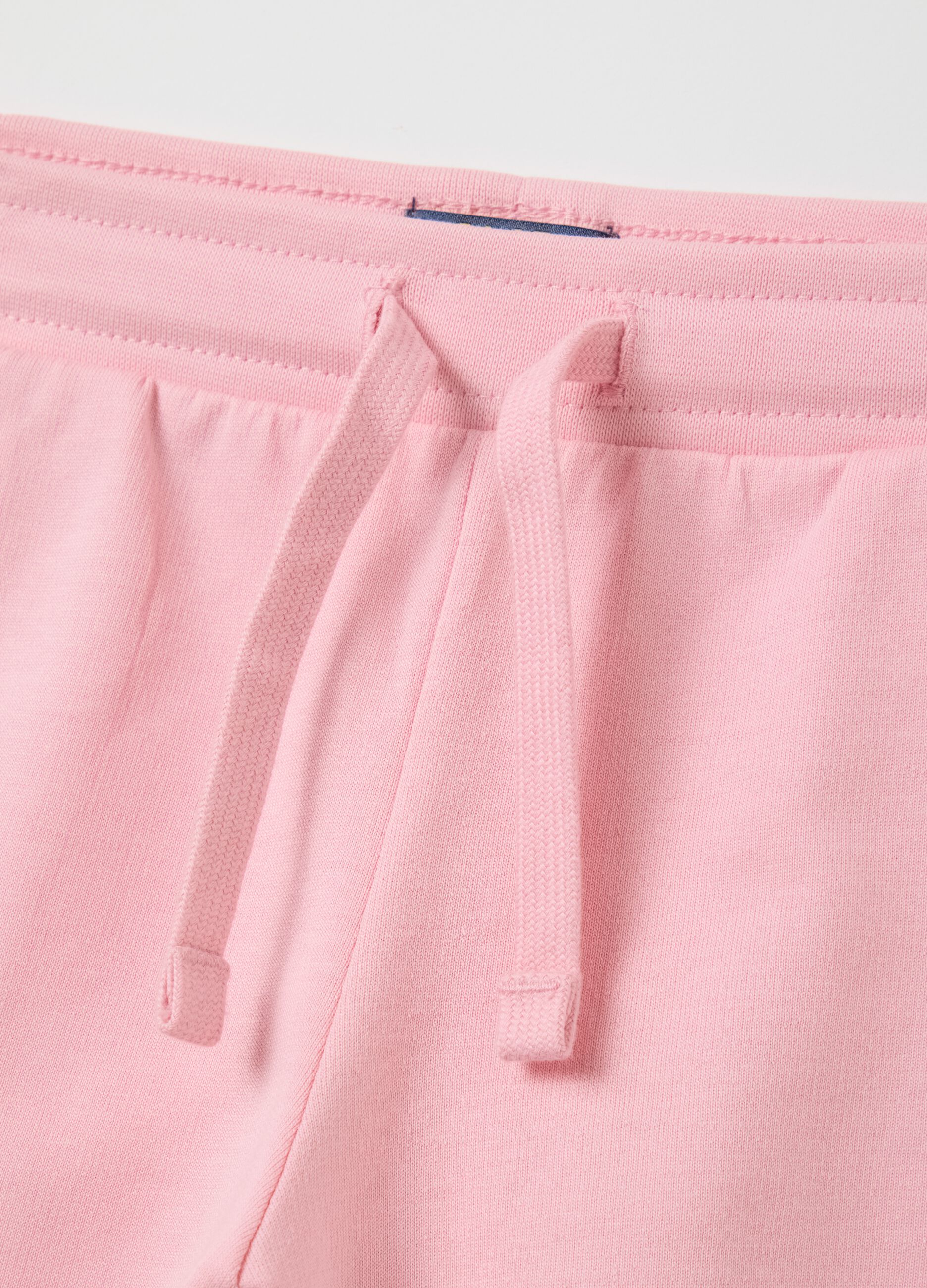 Jogging set with white T-shirt and pink shorts