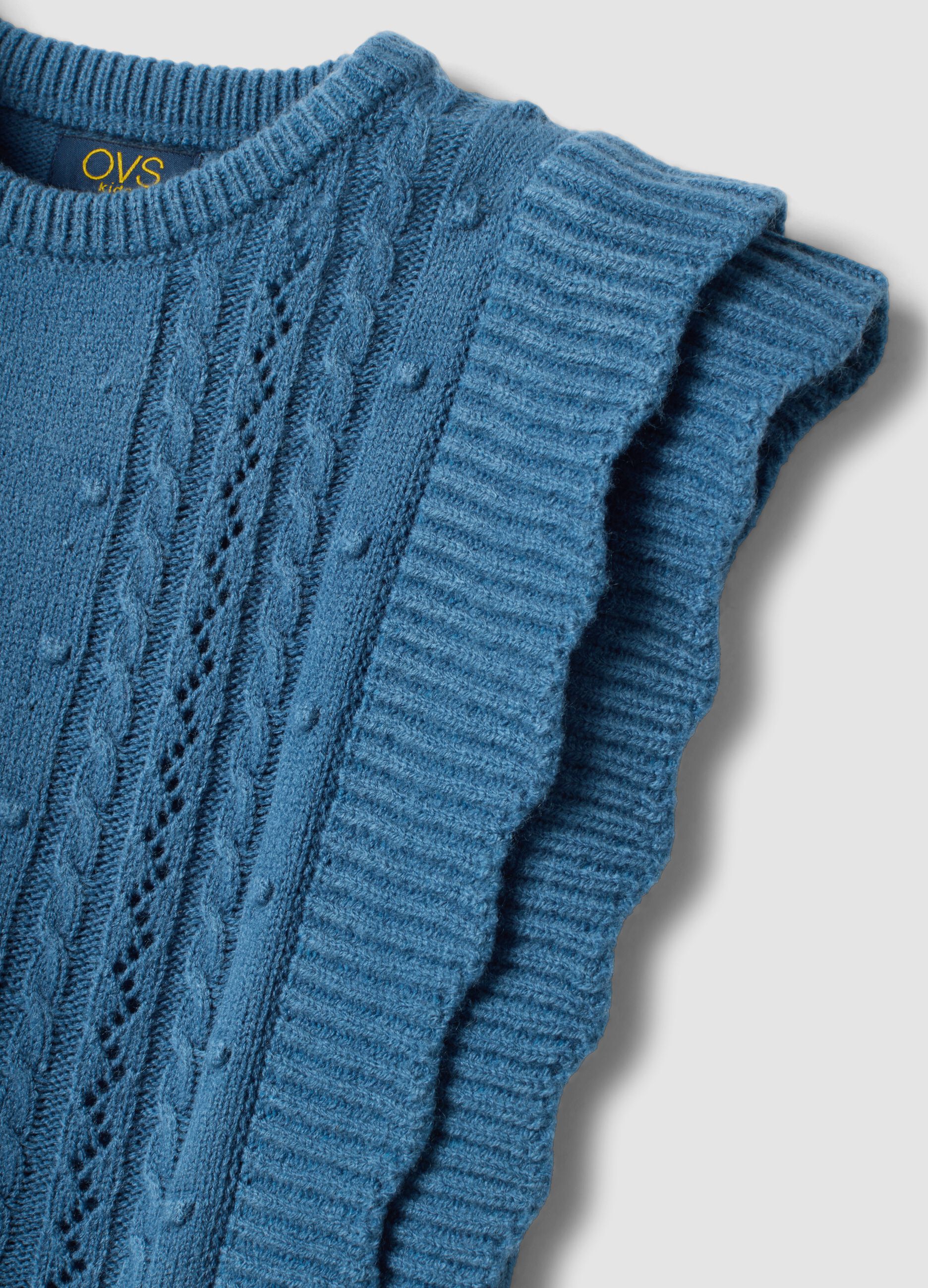 Blue knitted gilet with ruffles and cable knit