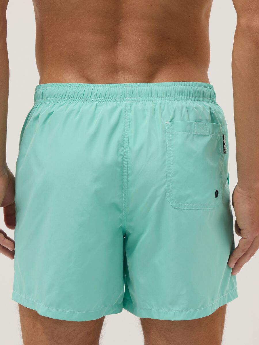 Light blue swim shorts with drawstring waist_4