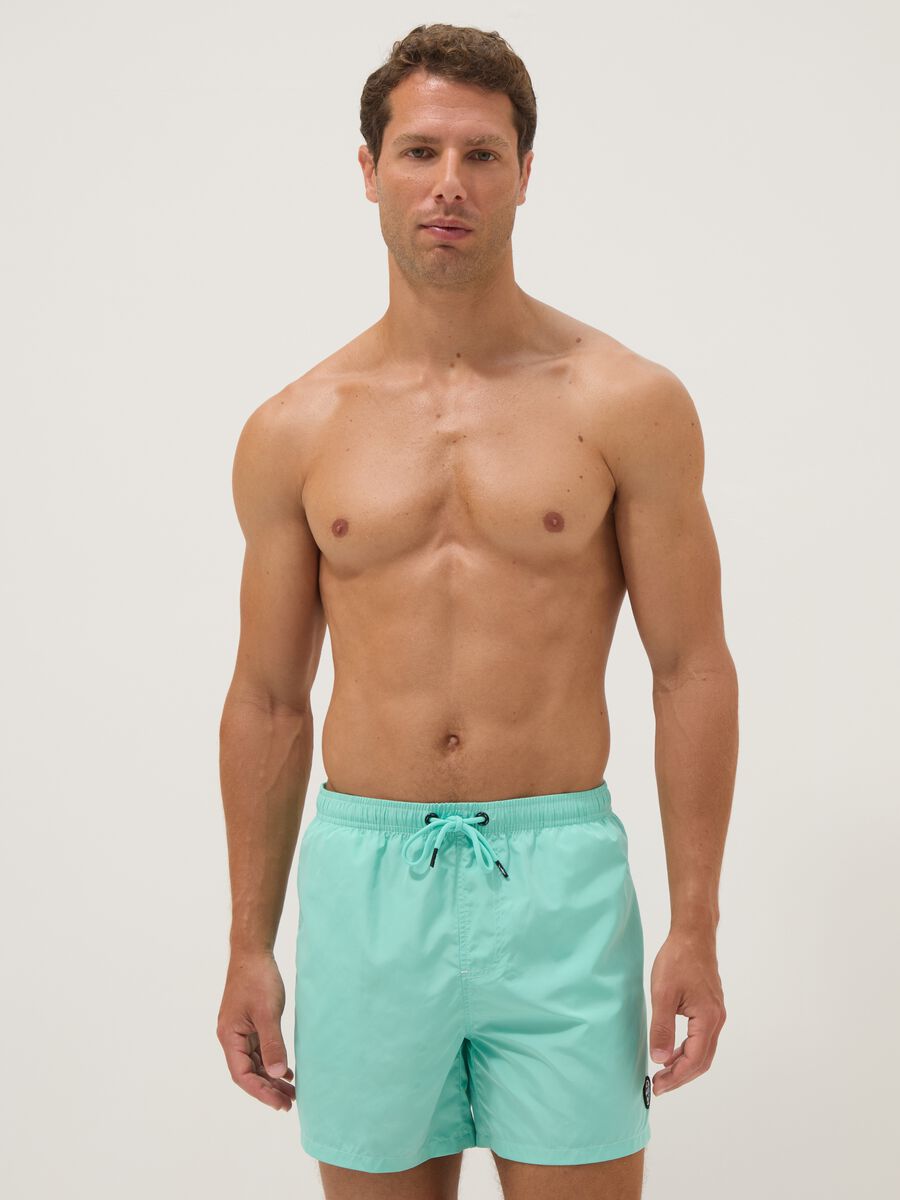 Light blue swim shorts with drawstring waist_1