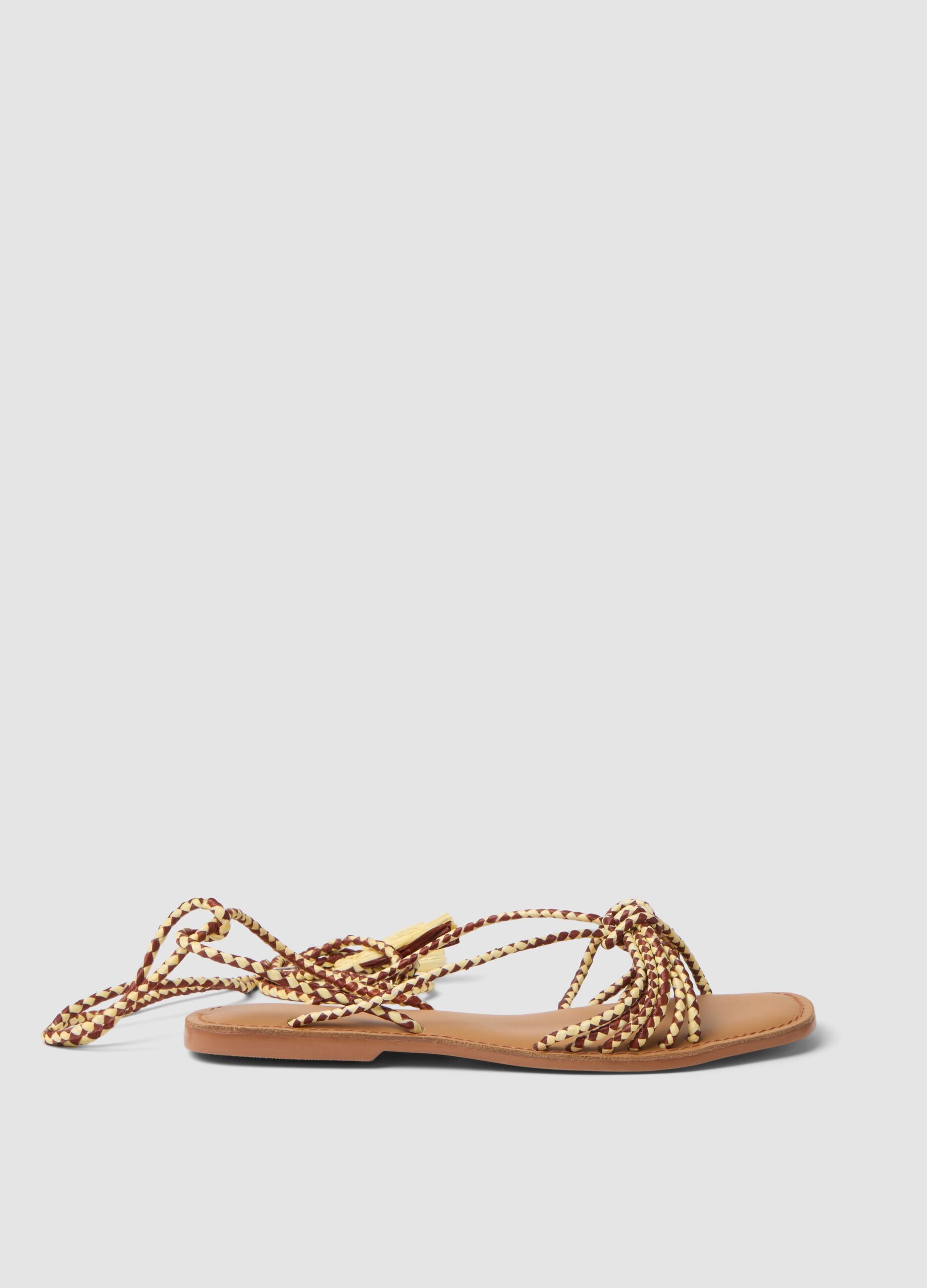 Brown flat sandals with braided tie-up straps