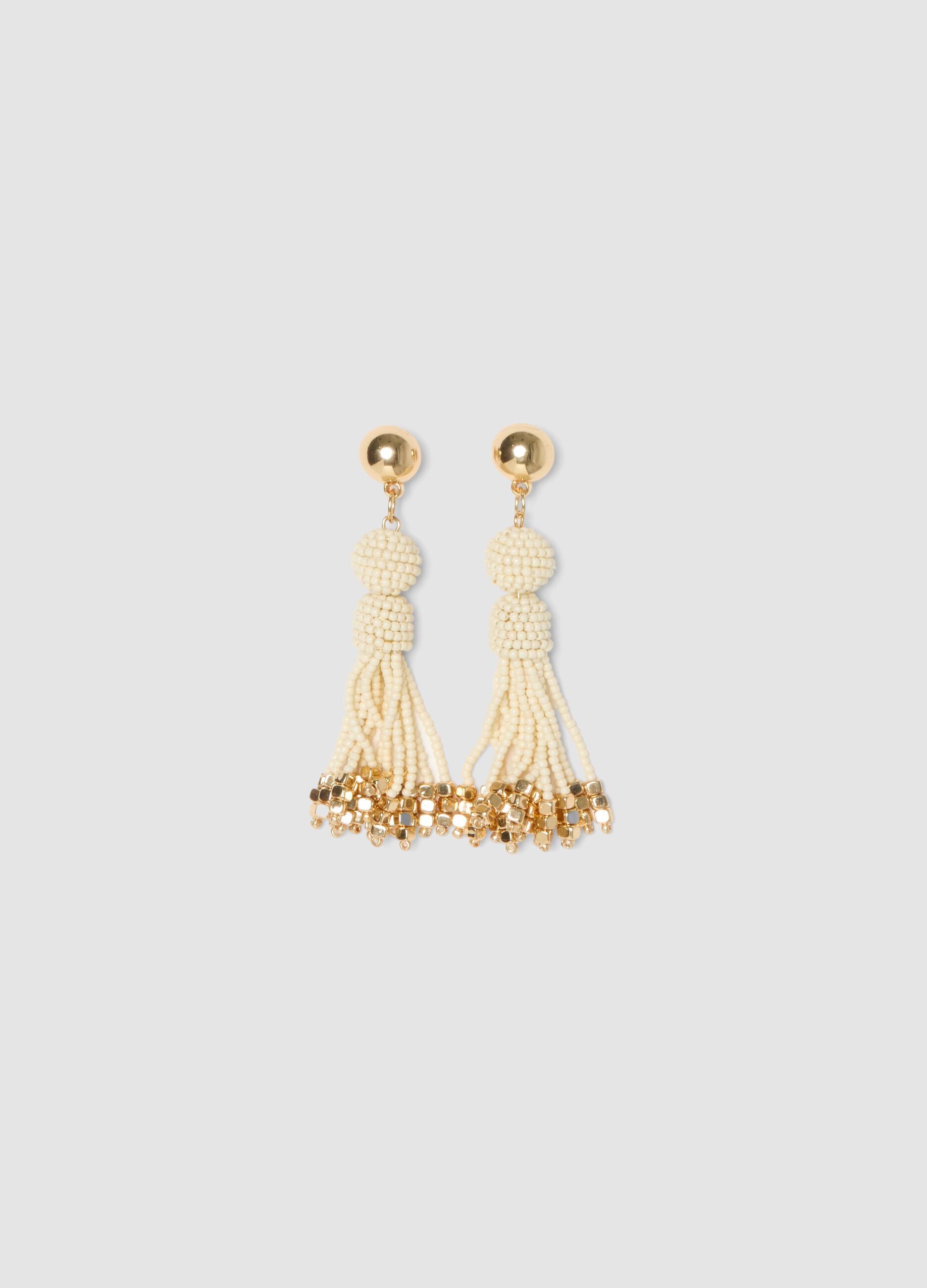 Elegant earrings with white glass beads and golden details