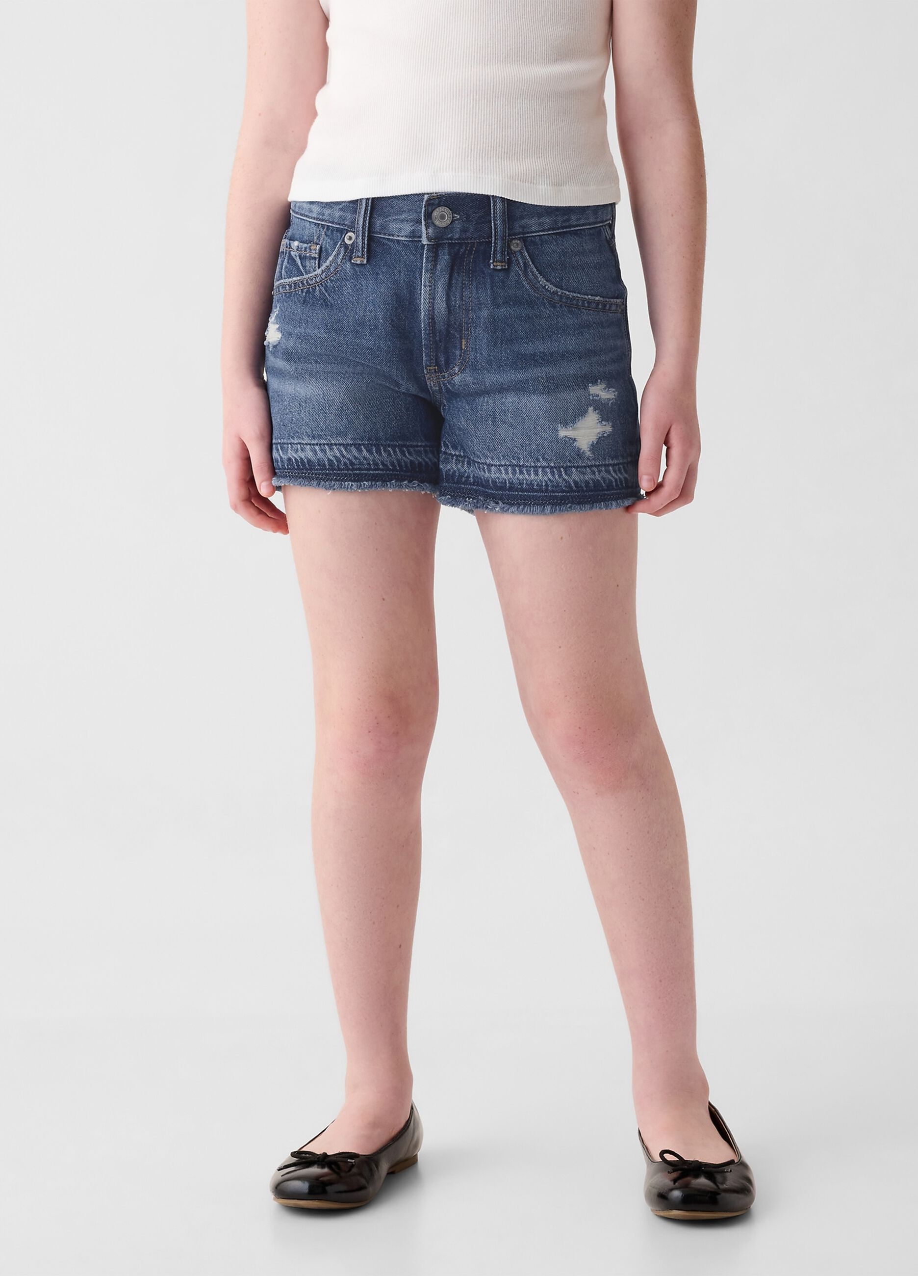 Shorts in denim con abrasioni a vita bassa