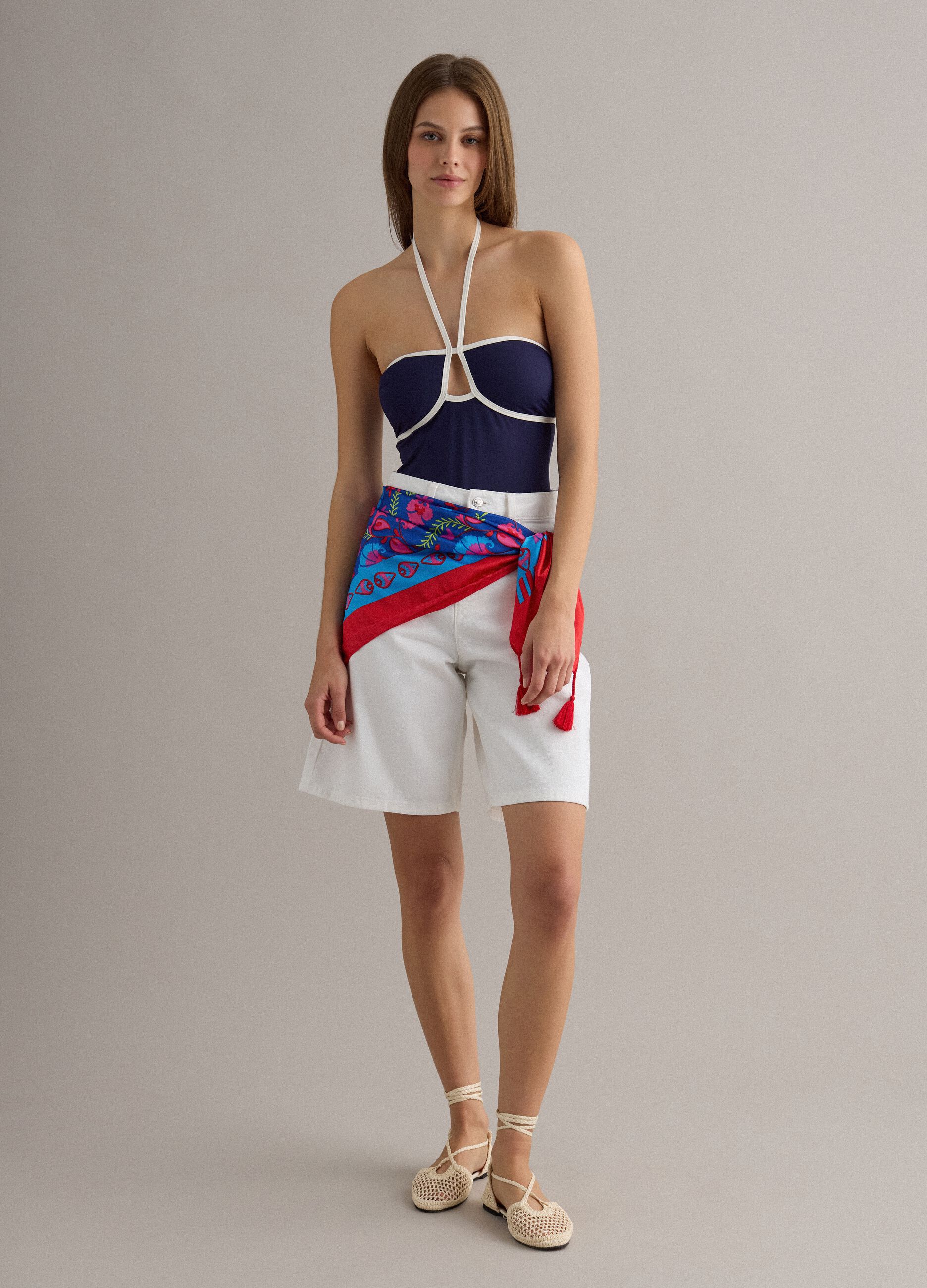 Blue stretch swimsuit with white piping