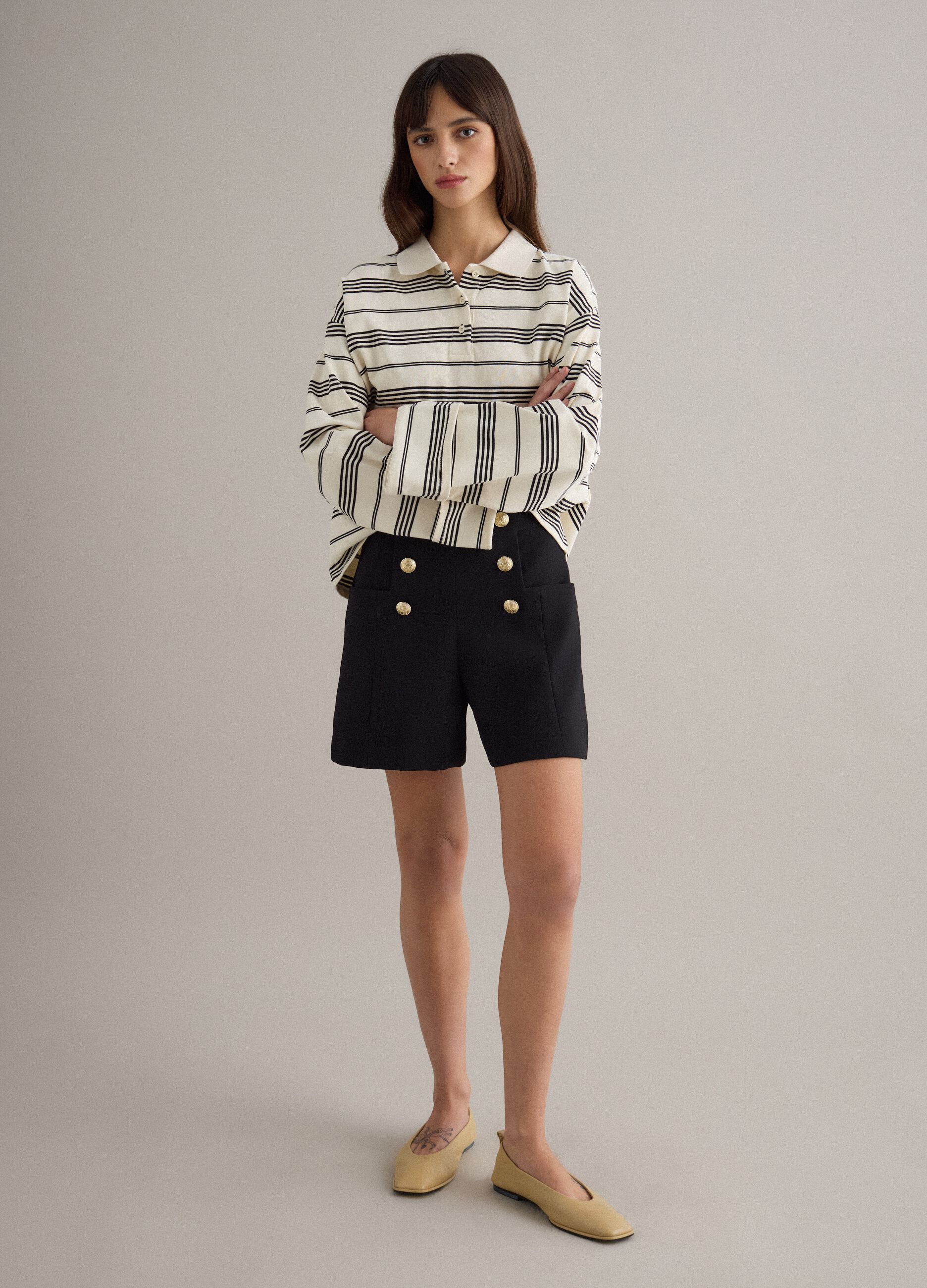 Black regular fit shorts with high waist and gold buttons