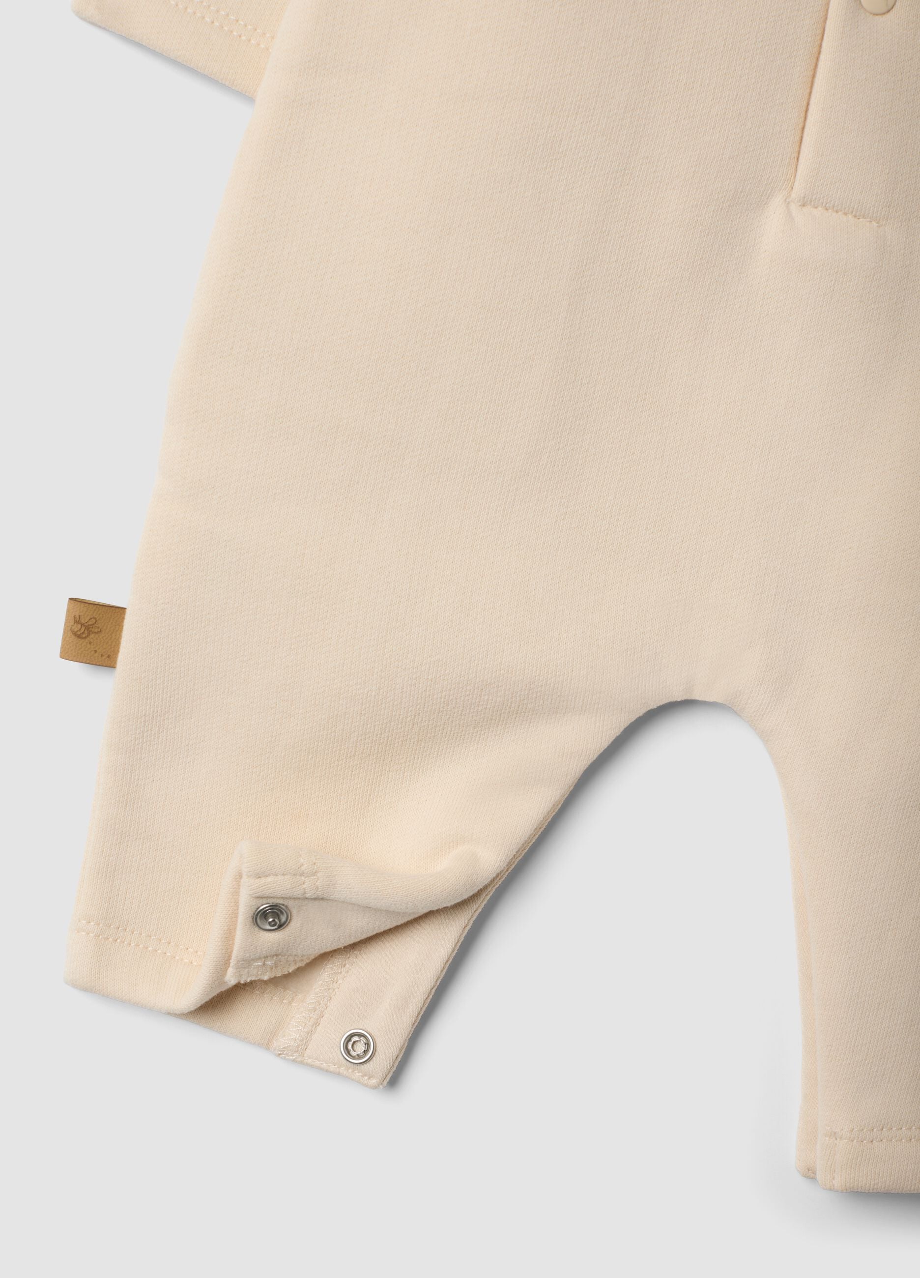 Beige organic cotton Winnie the Pooh babygrow