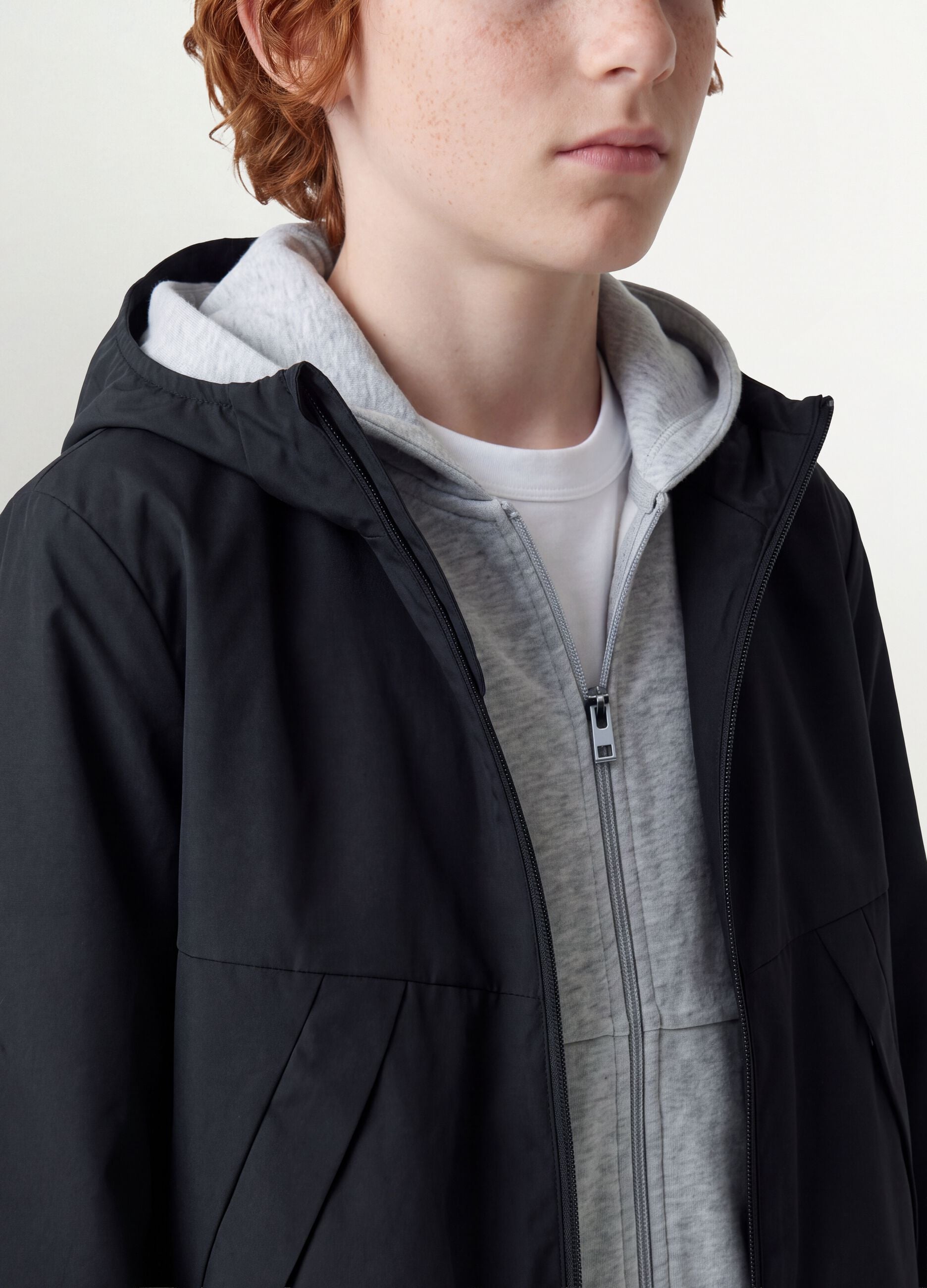 Black oversized rain jacket with hood and zip for boys