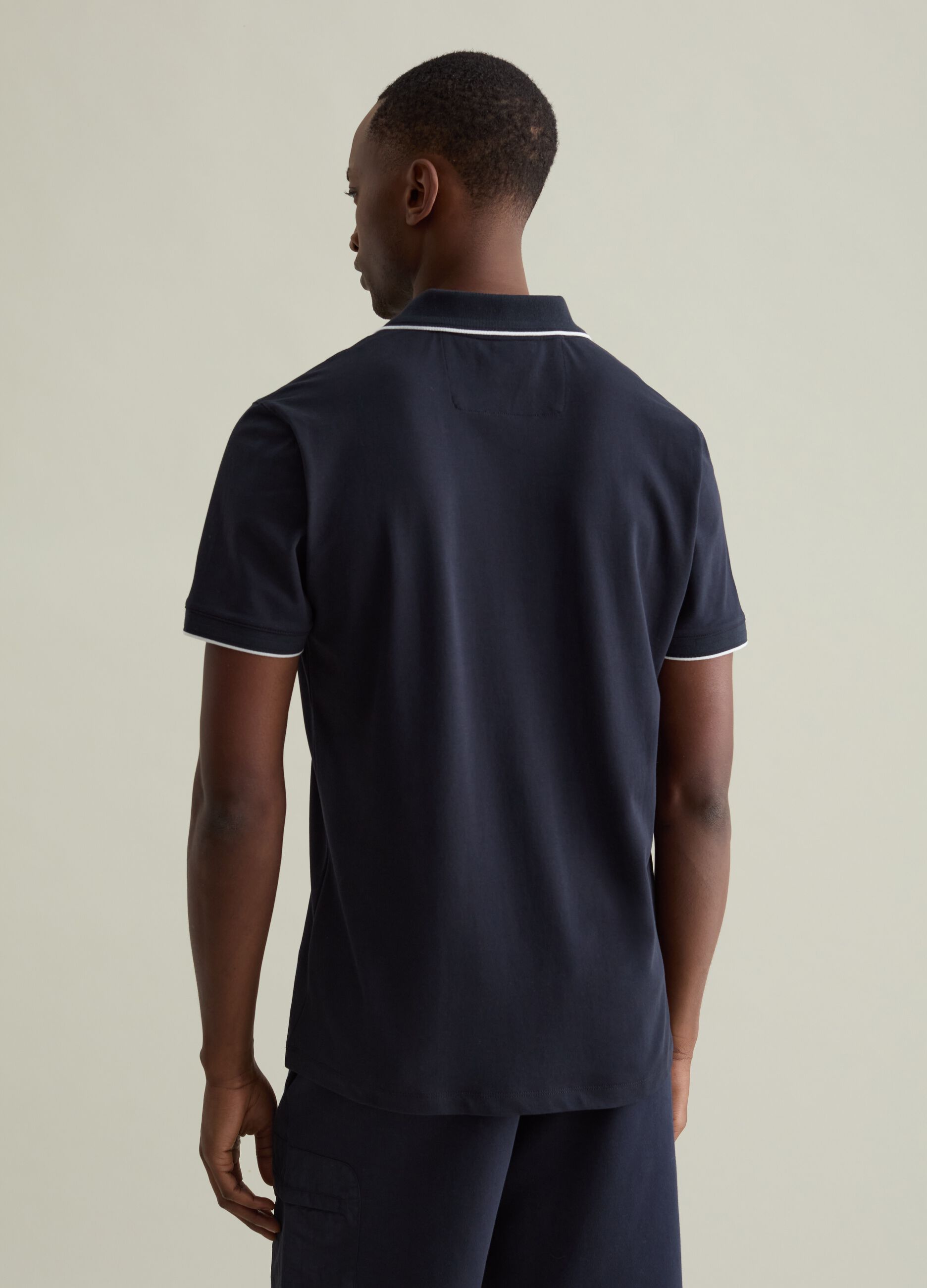 Polo shirt in technical fabric with contrasting edging