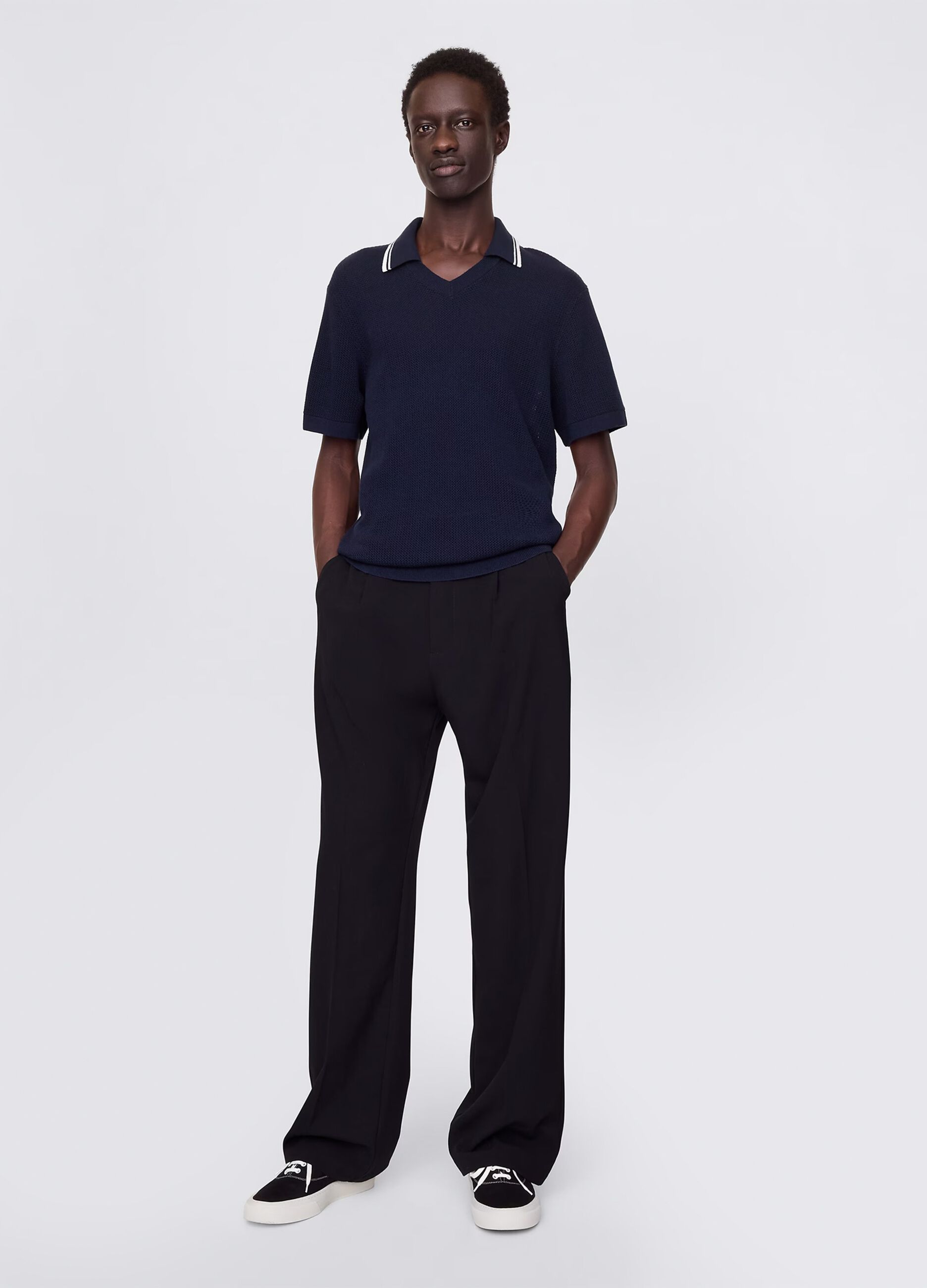 Polo traforata in cotone blu