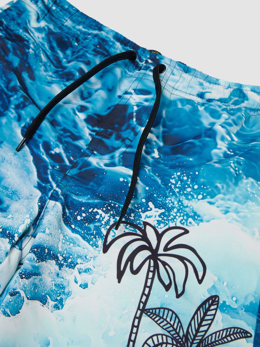 Blue boys&rsquo; swim shorts with wave and palm print_2