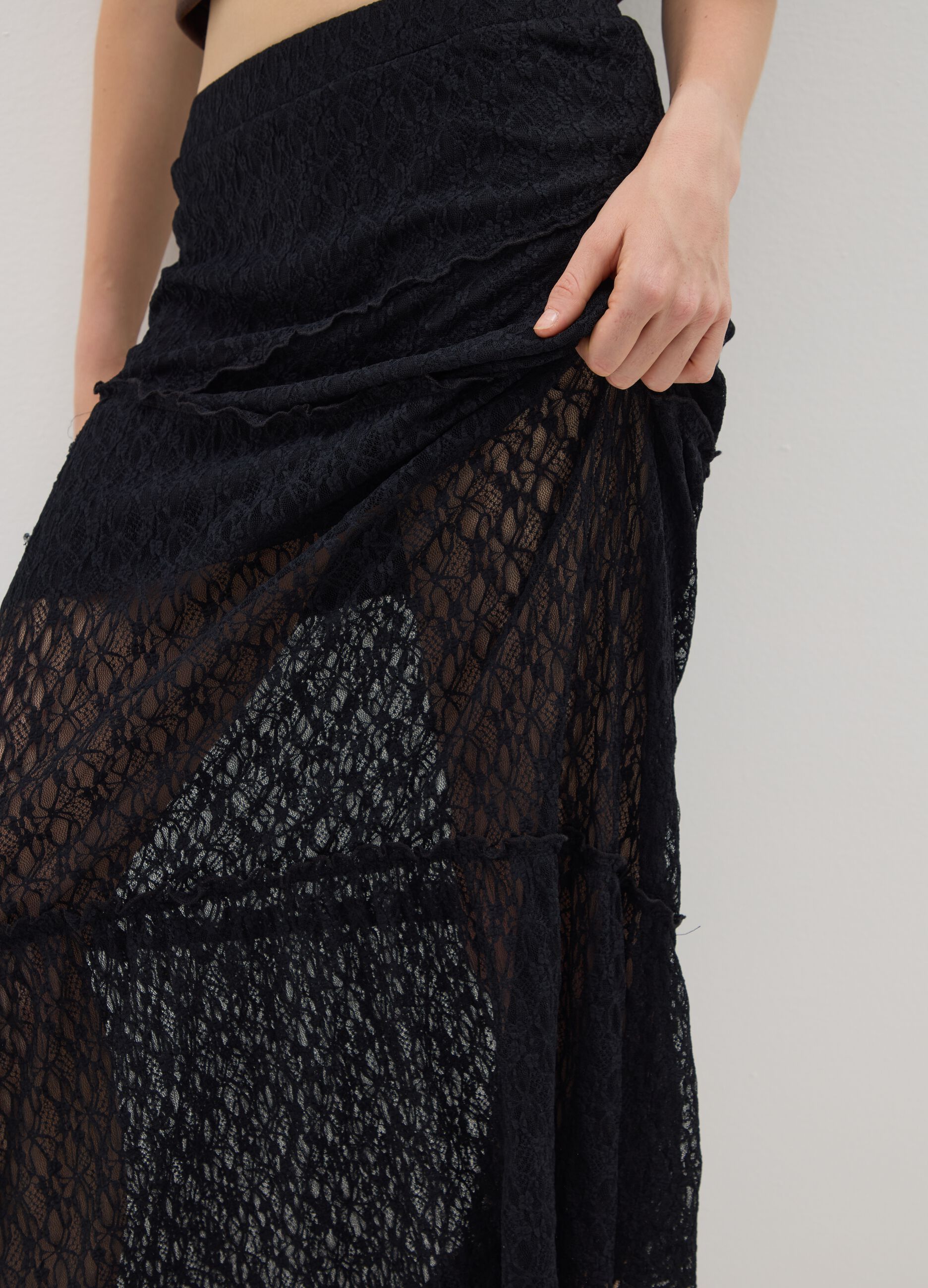 Long black lace skirt with asymmetric design