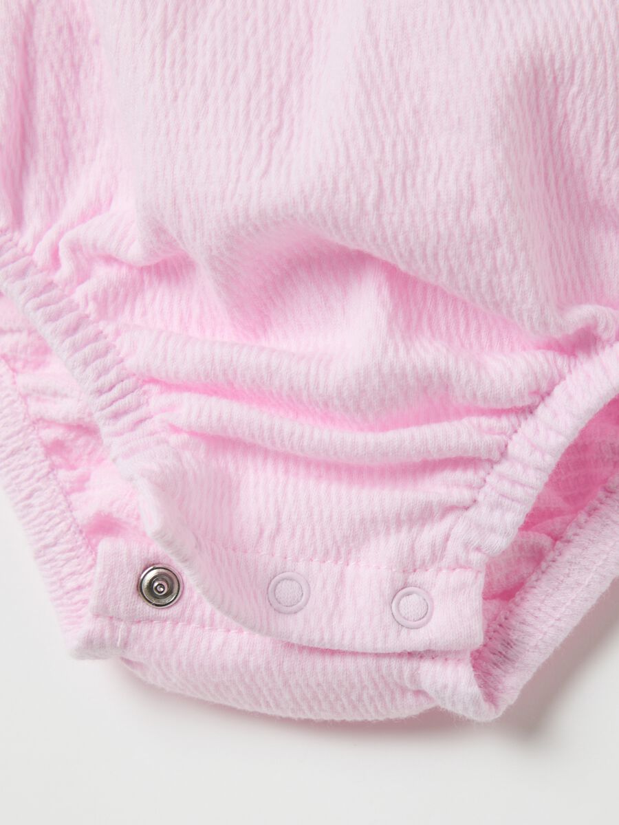 Pink sleeveless bodysuit with flounce_2