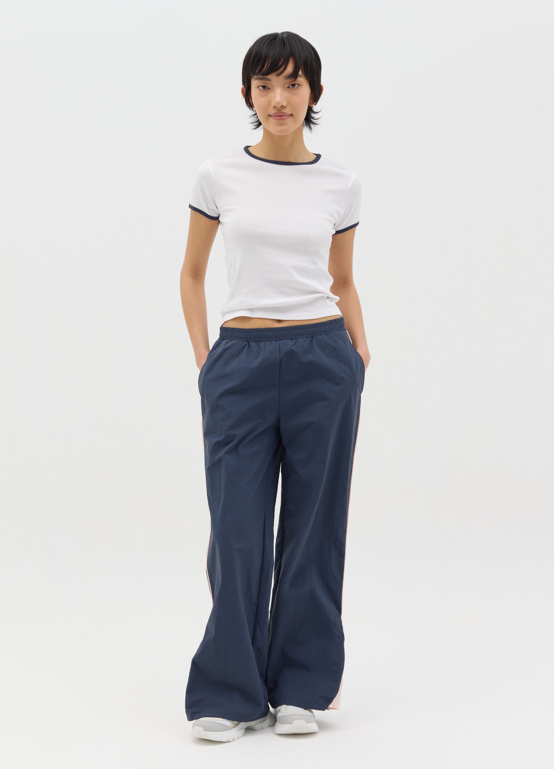 Navy blue nylon joggers with splits and zip