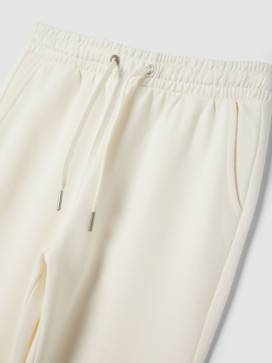 Pantaloni bianchi flare in puro cotone organico_2