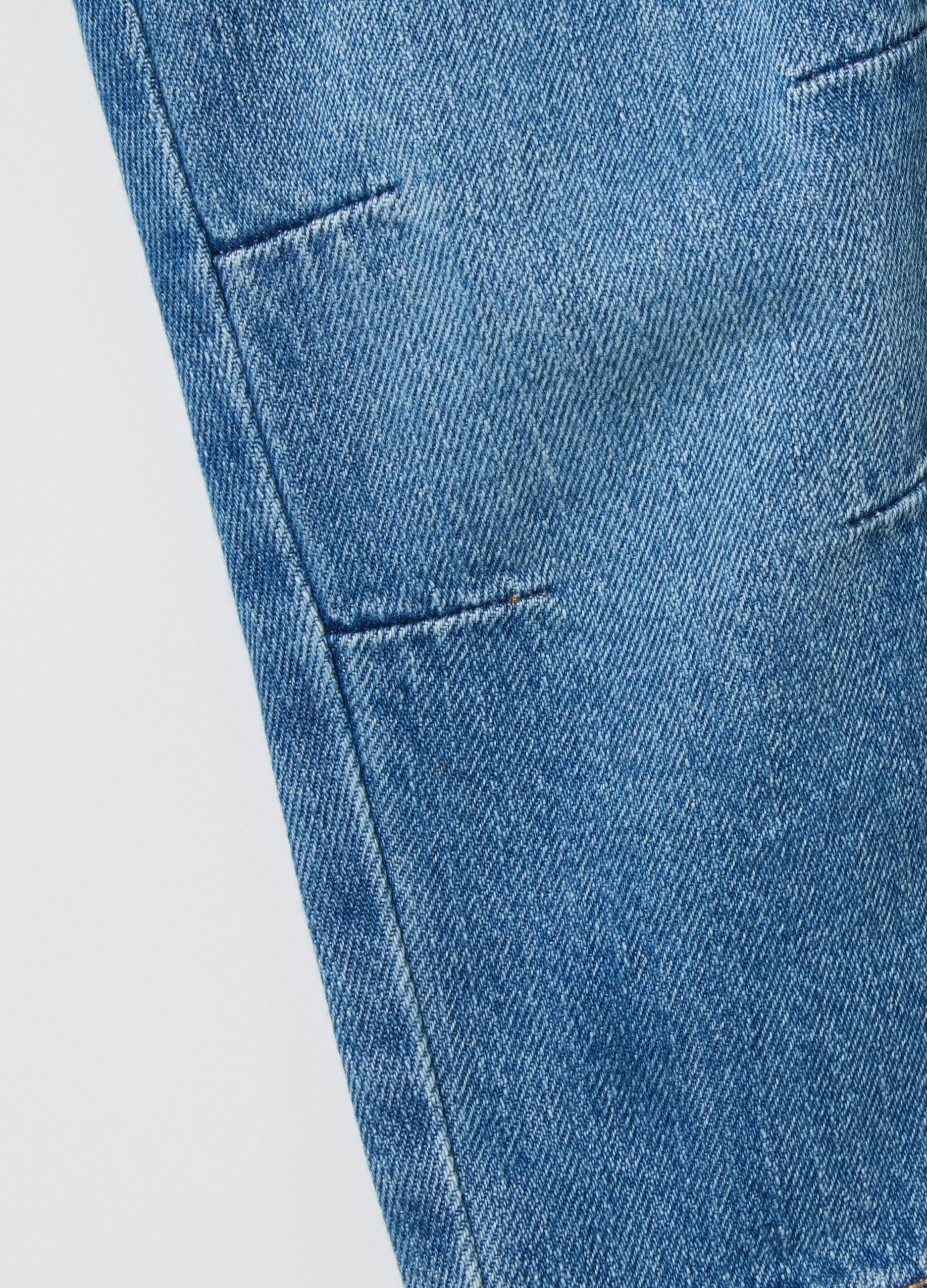 Pantaloni blu in denim con elastico e coulisse