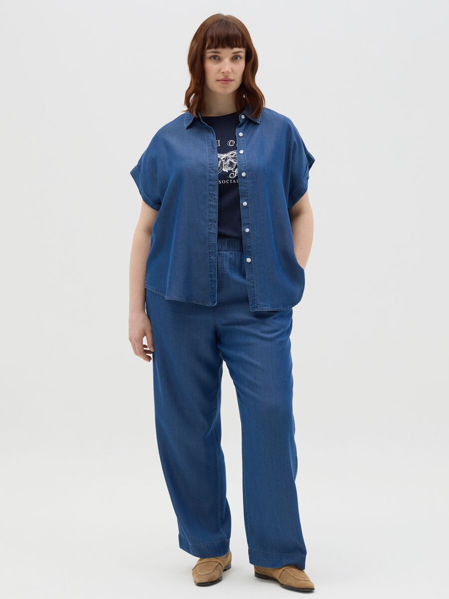 Curvy blue jogger trousers with denim effect_0