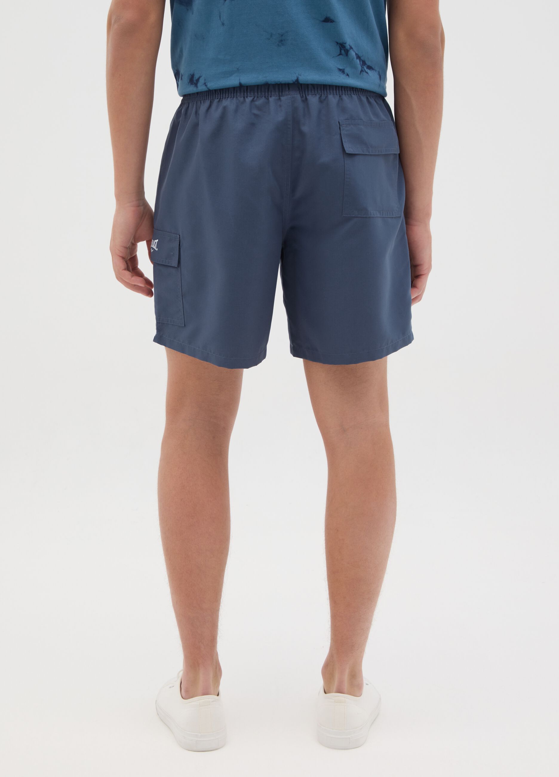Blue swimming trunks with logo print