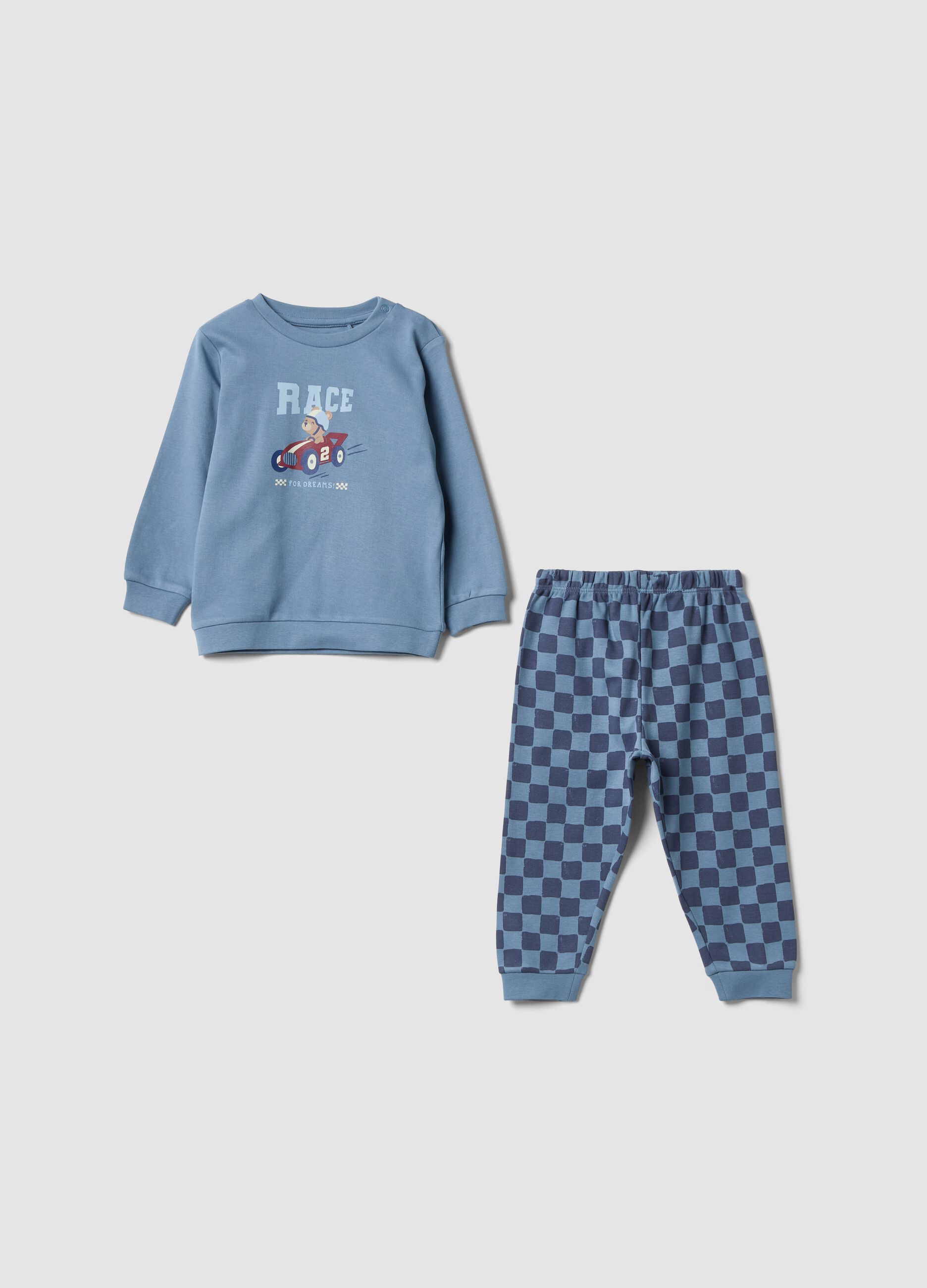 Blue organic cotton baby pyjamas with checked trousers