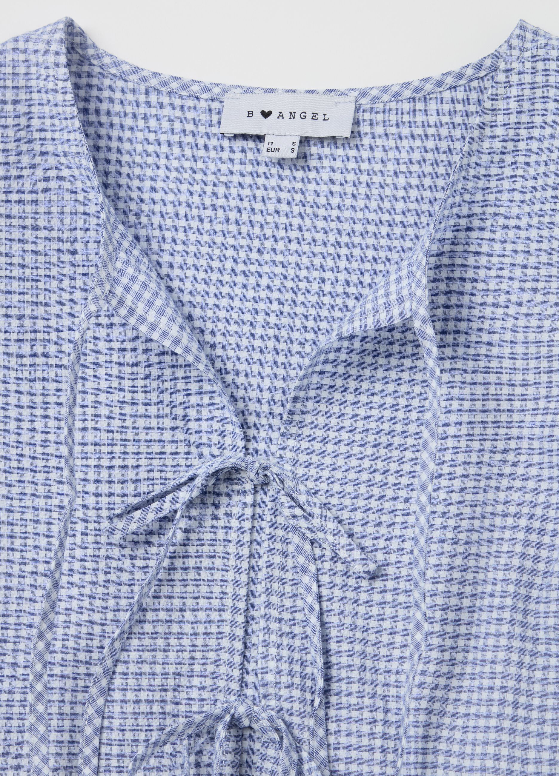 Blusa in seersucker a quadretti con laccetti
