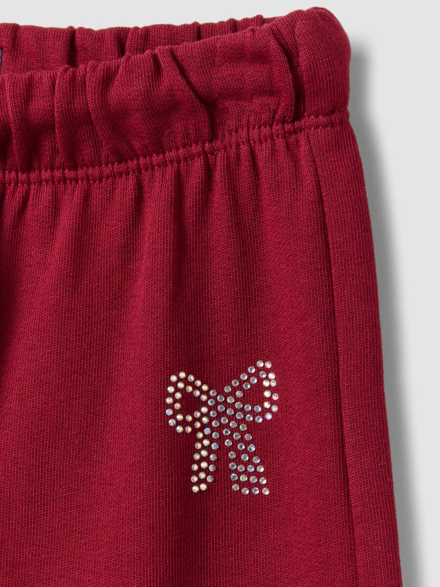 Pantaloni rossi in puro cotone con vita elasticizzata e fiocco per bambina_2