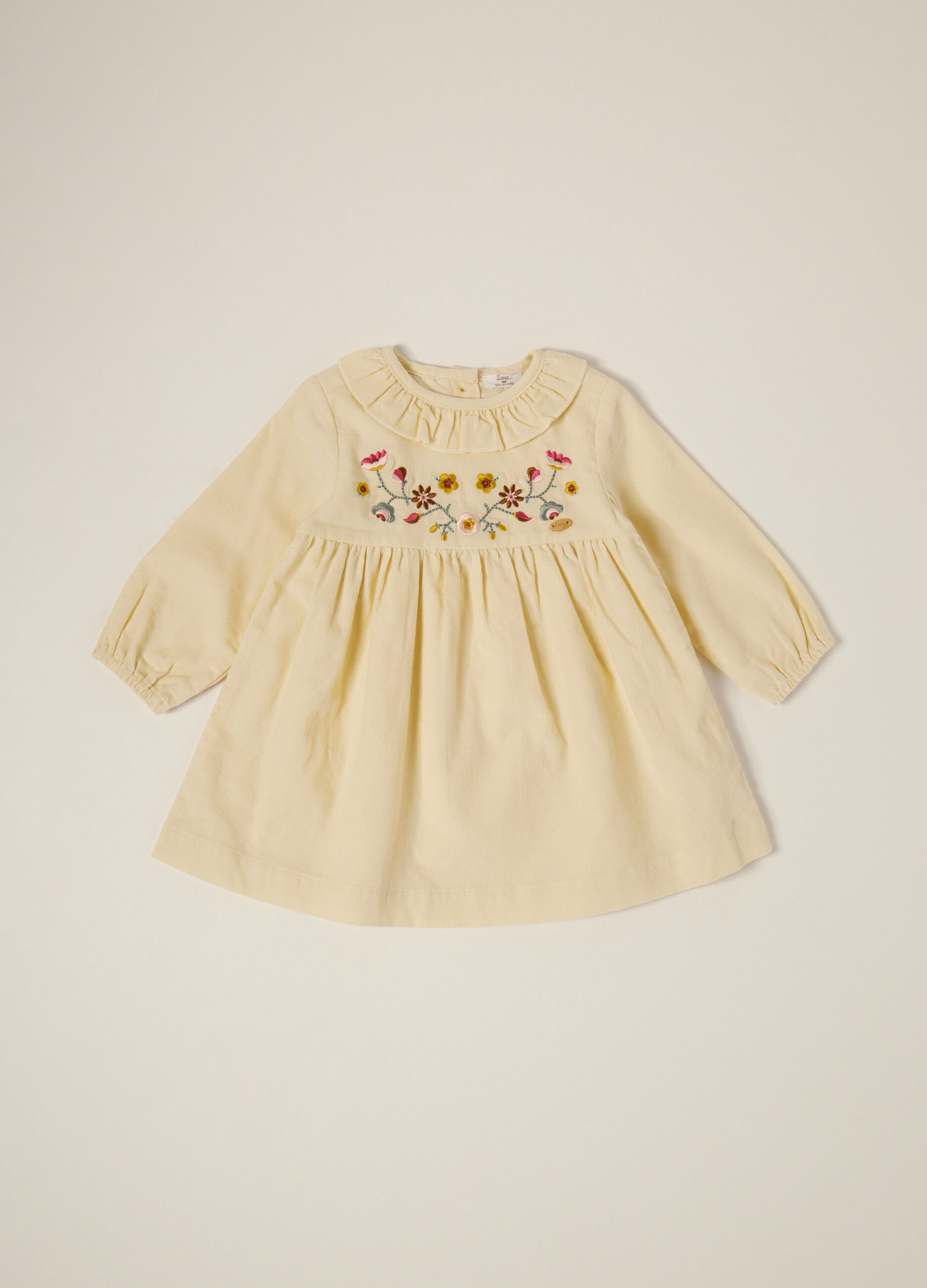 Beige corduroy dress with floral embroidery