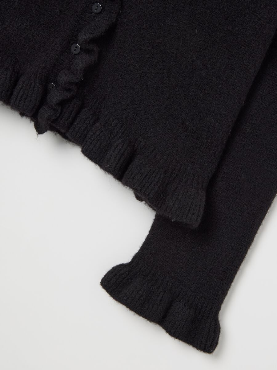 Cardigan nero con volant in misto materiali_1