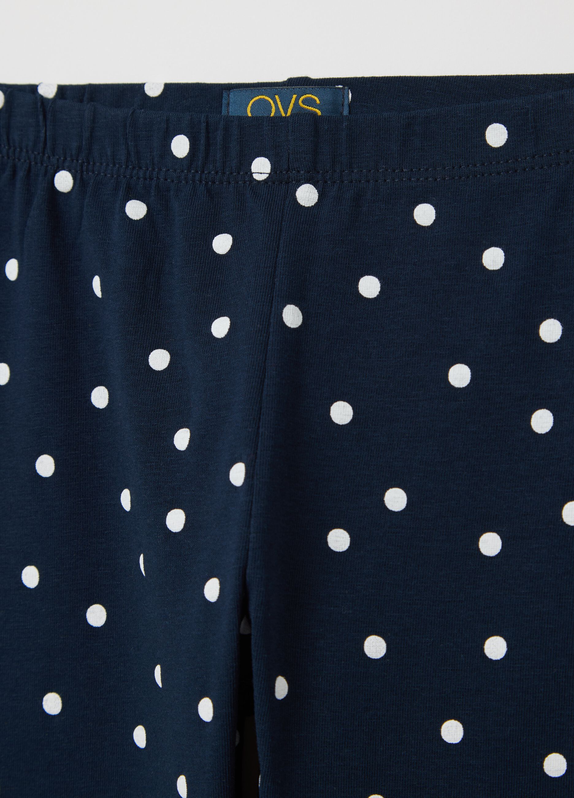 Blue three-quarter leggings with polka dot pattern
