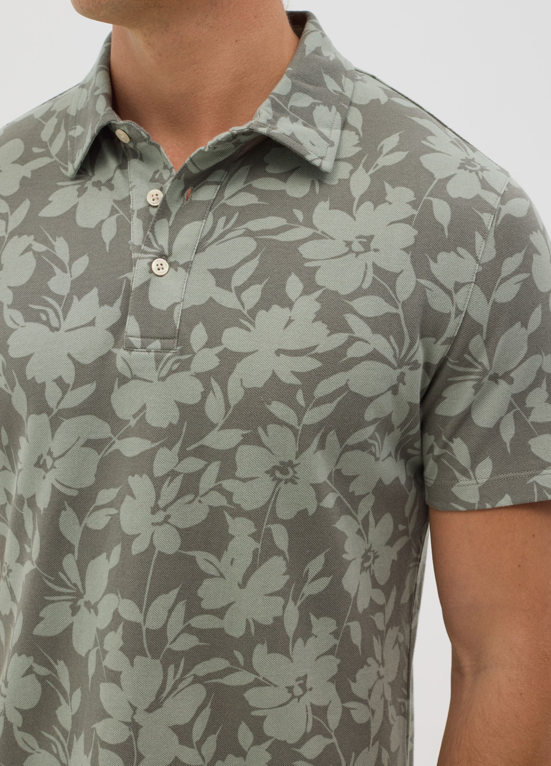 BST green polo shirt with short sleeves and floral print