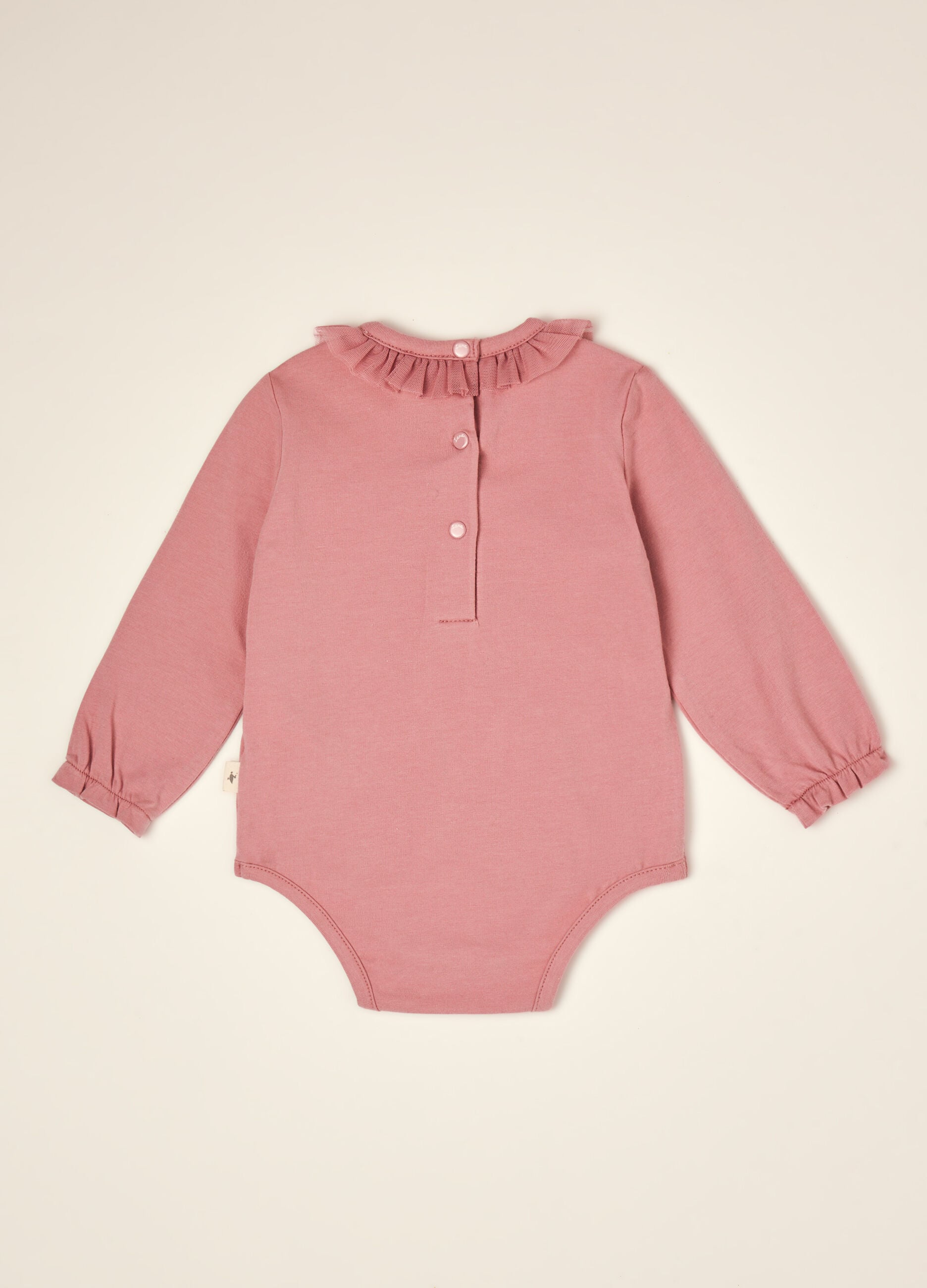 Pink organic stretch cotton bodysuit with ruffled crew neck