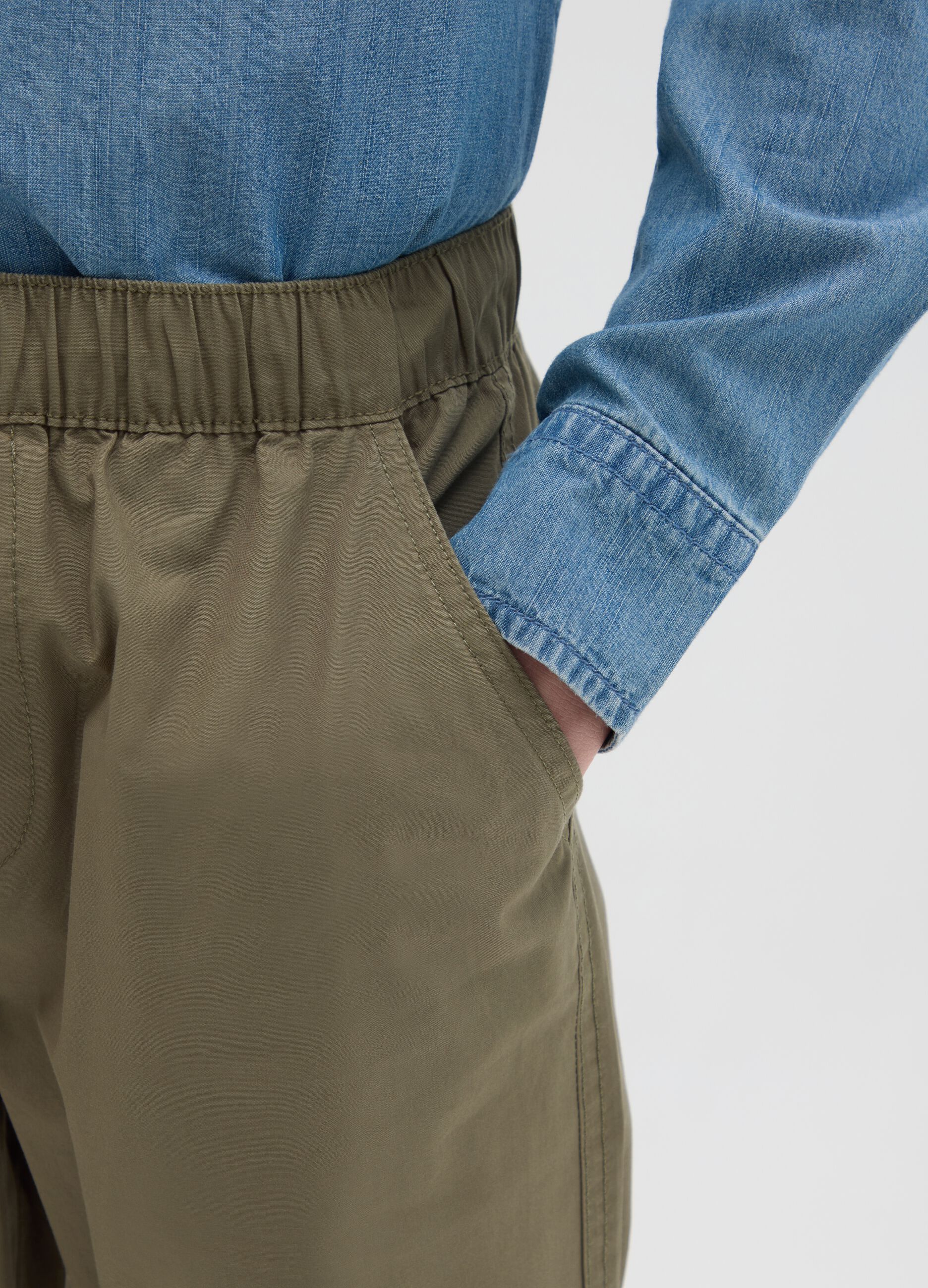 Boys’ trousers in 100% green cotton.