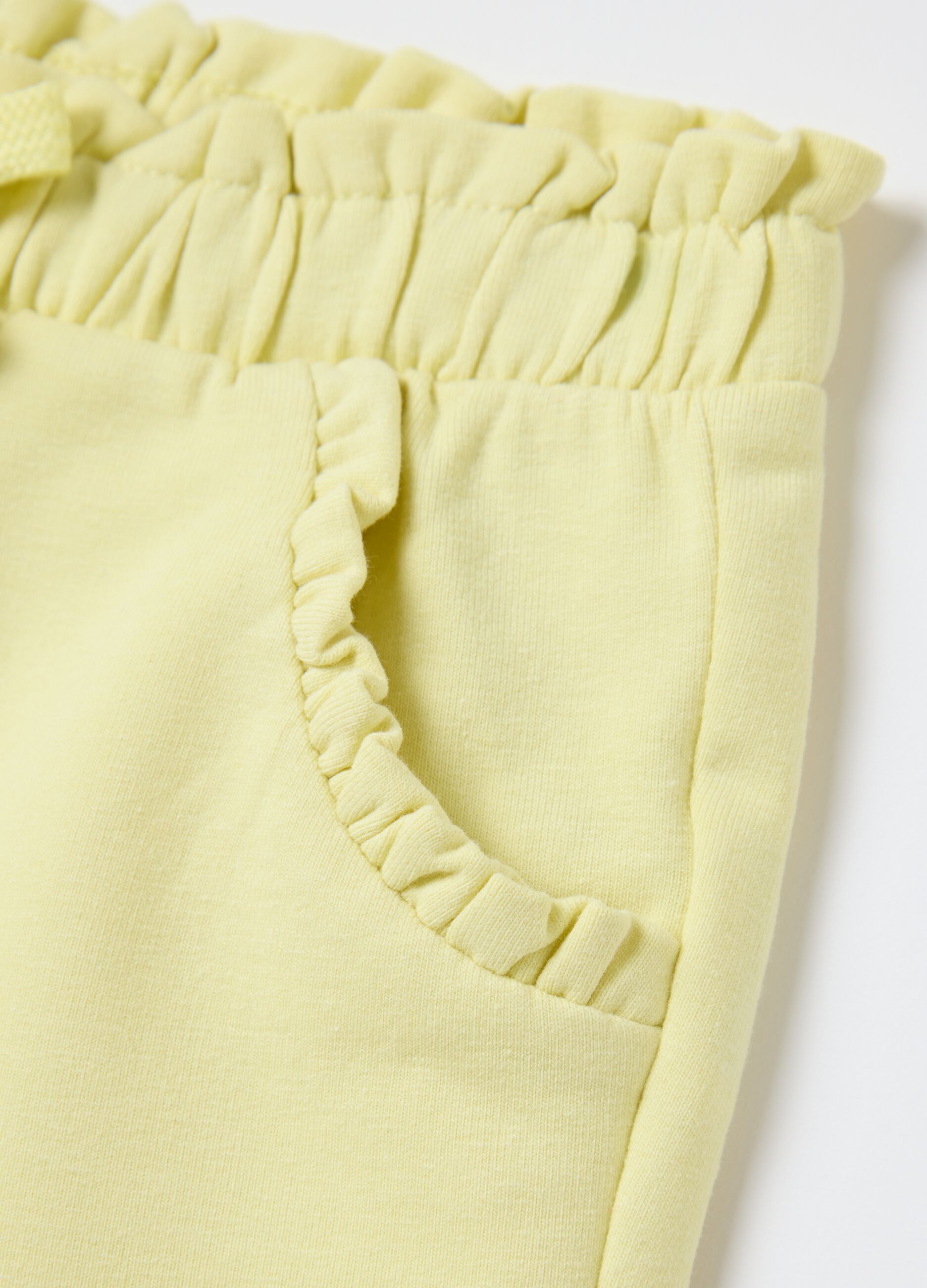 Yellow French terry shorts with bow and frills
