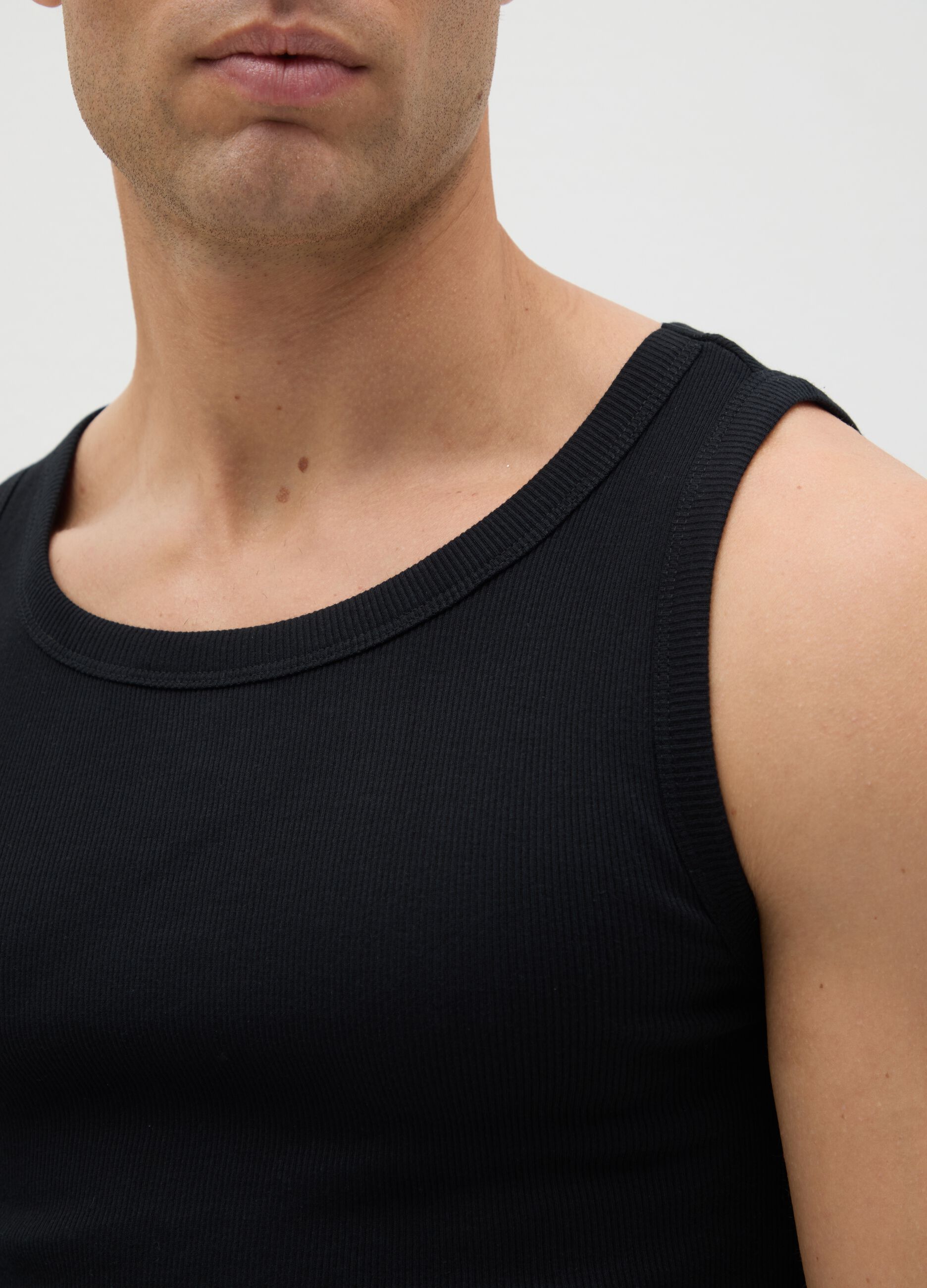 Black vest with round ribbed neck