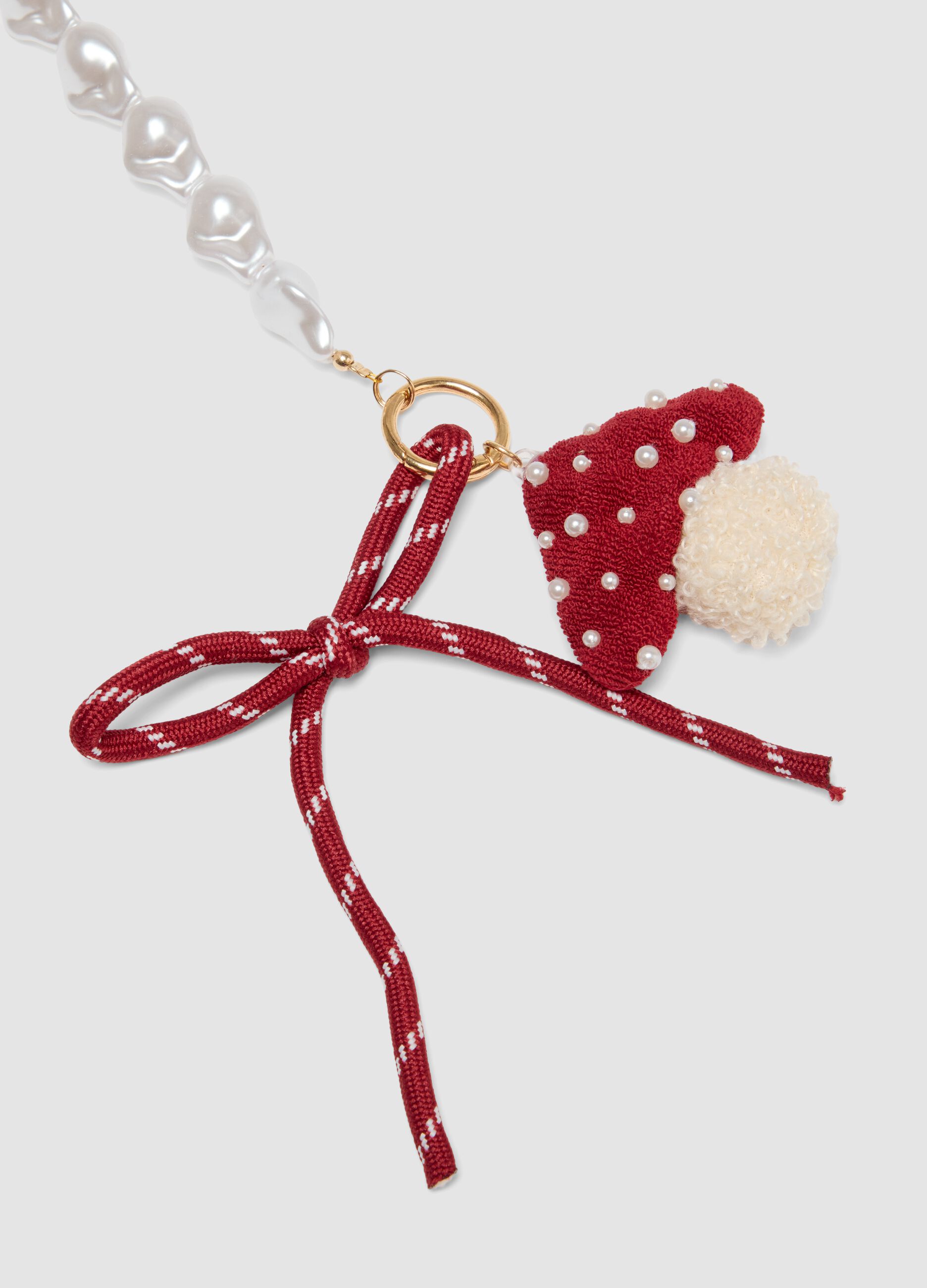 Red bracelet with hat charm and pearls