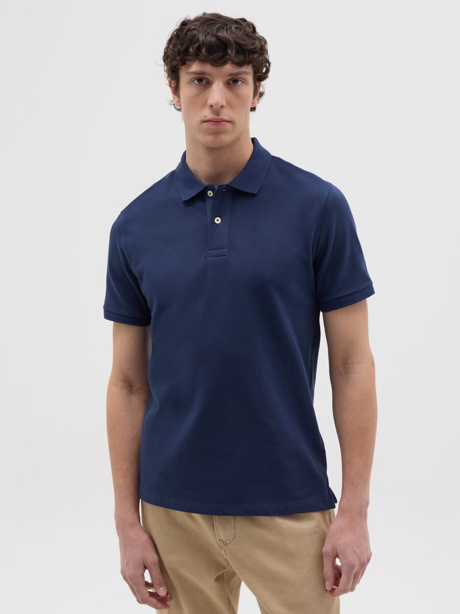Solid colour polo shirt in organic cotton_0