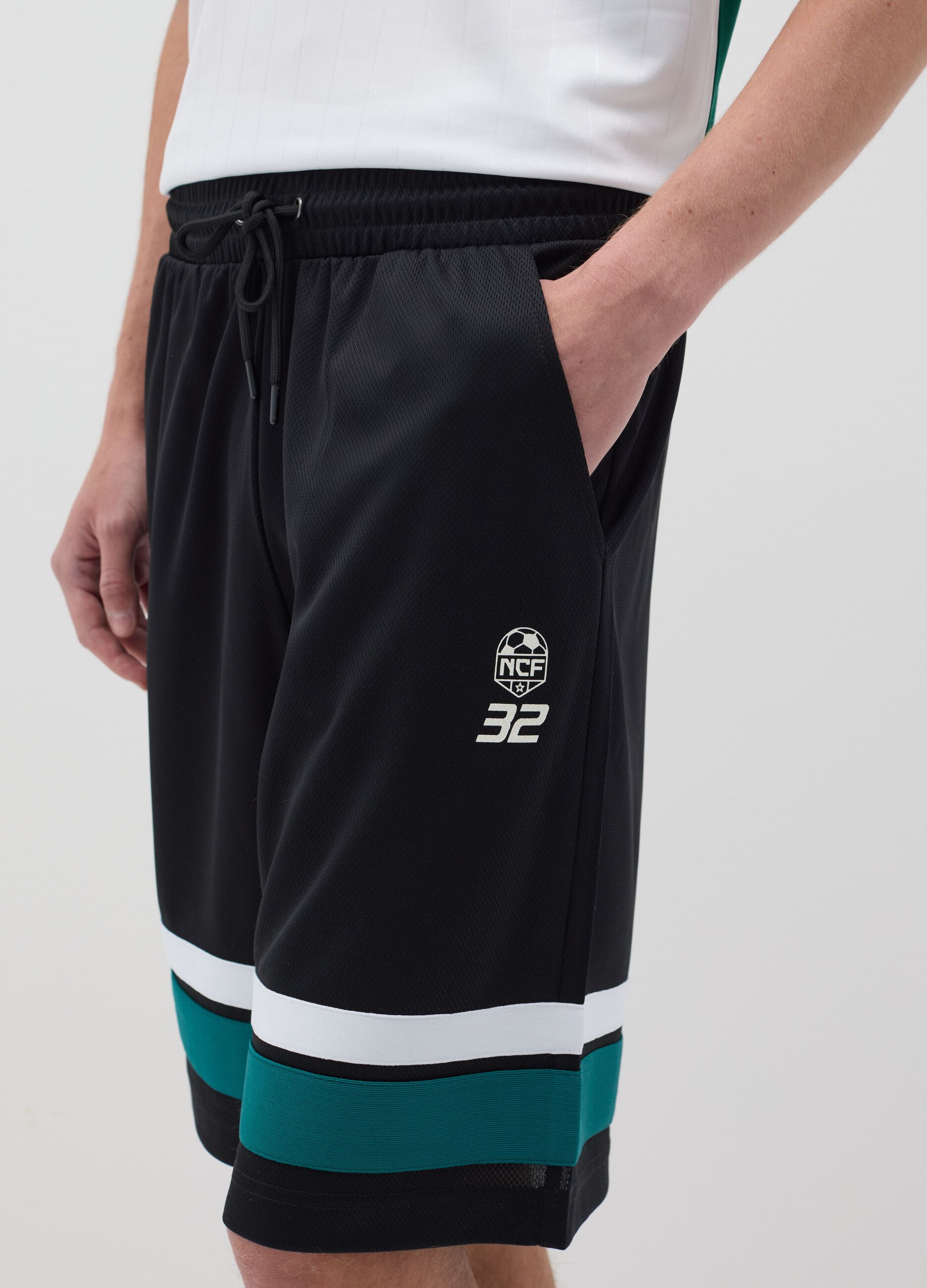 Black Bermuda joggers with NFC print