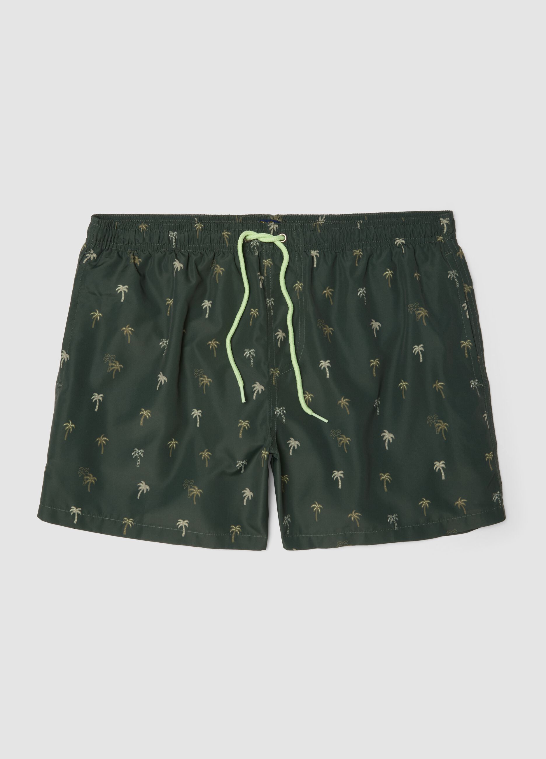 Green boxer swim shorts with palm print