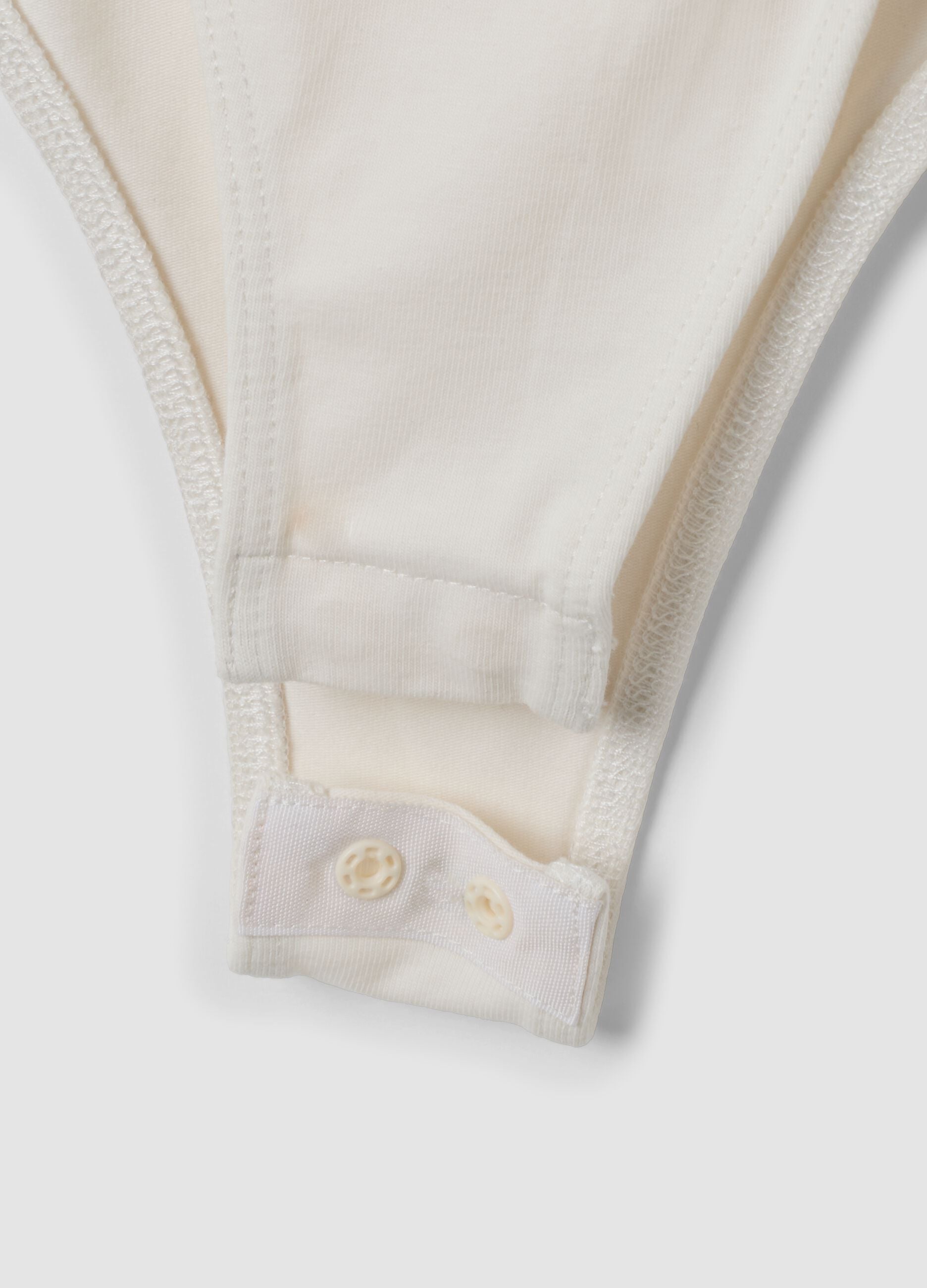 White fitted stretch-cotton bodysuit with lace