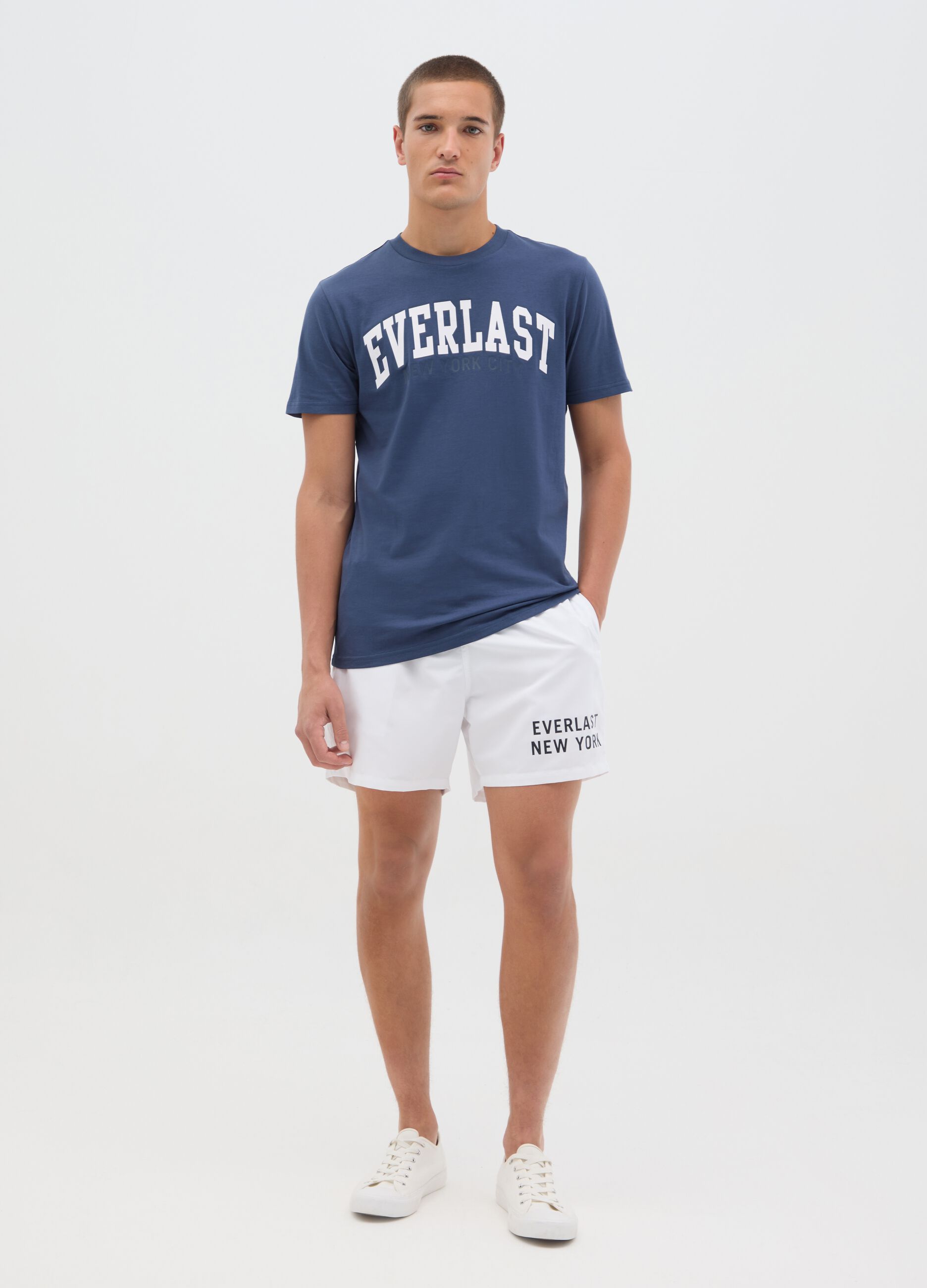 White swimming trunks with logo print