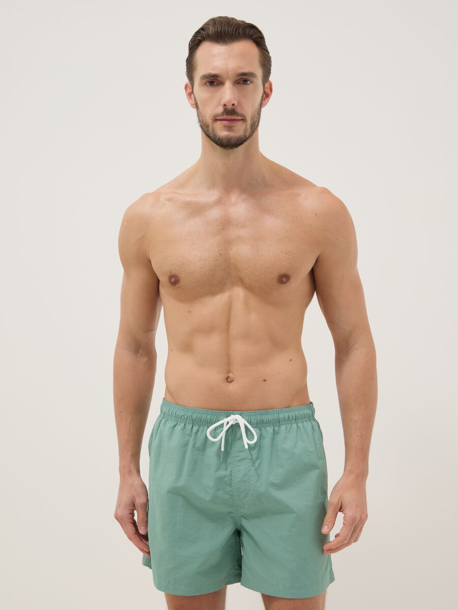 Green swim shorts with elasticated waistband_0