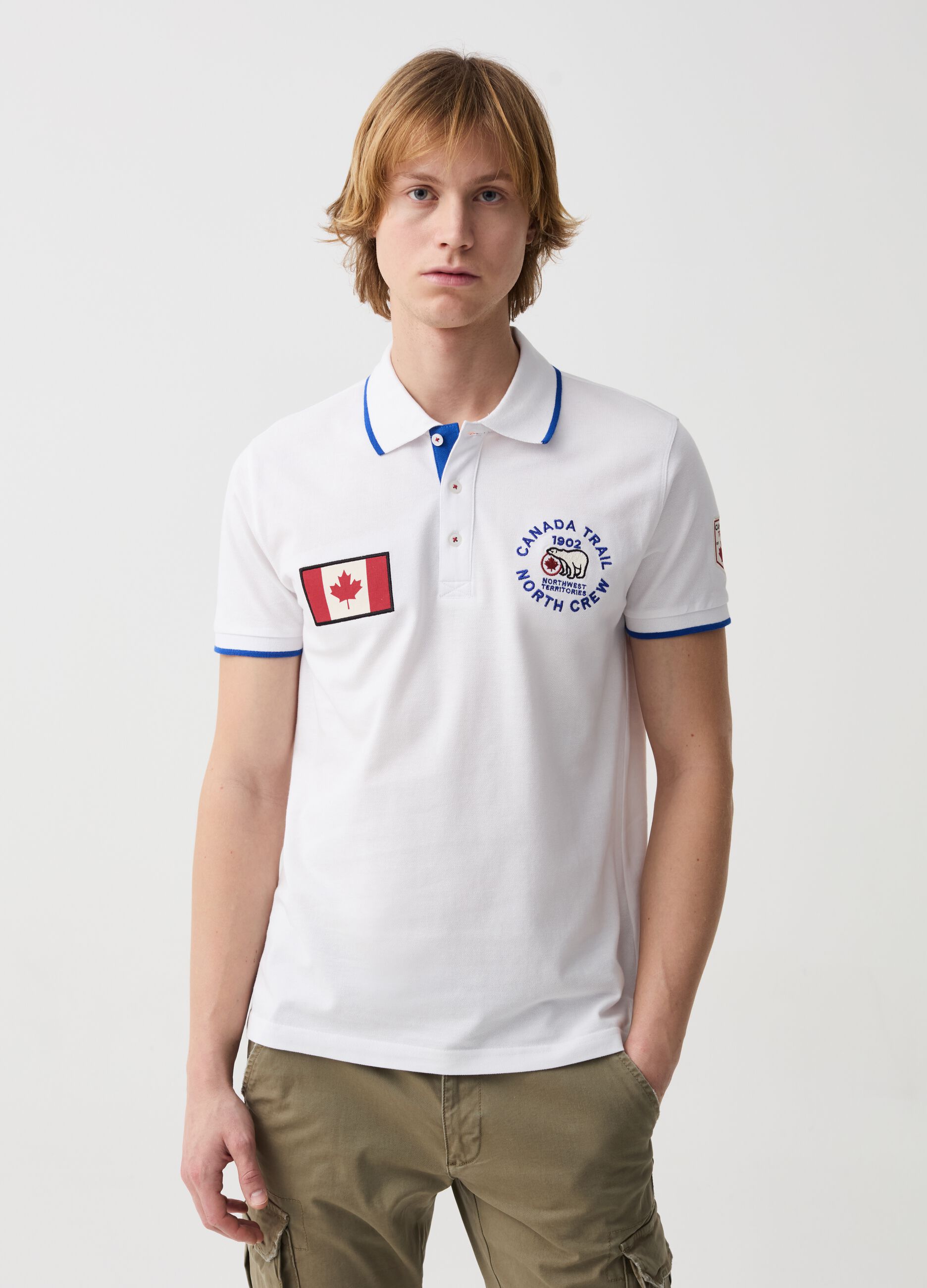 Polo shirt with striped edging and logo embroidery