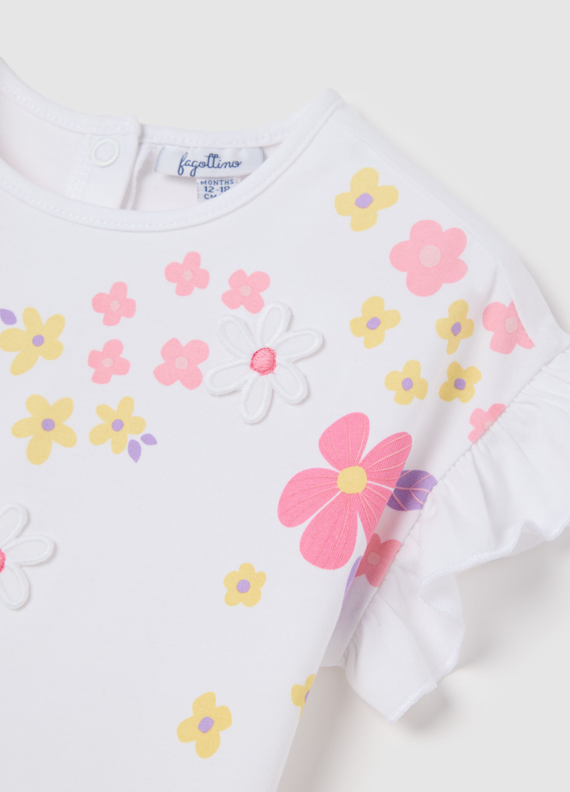 White short-sleeve t-shirt with ruffles and colourful flowers
