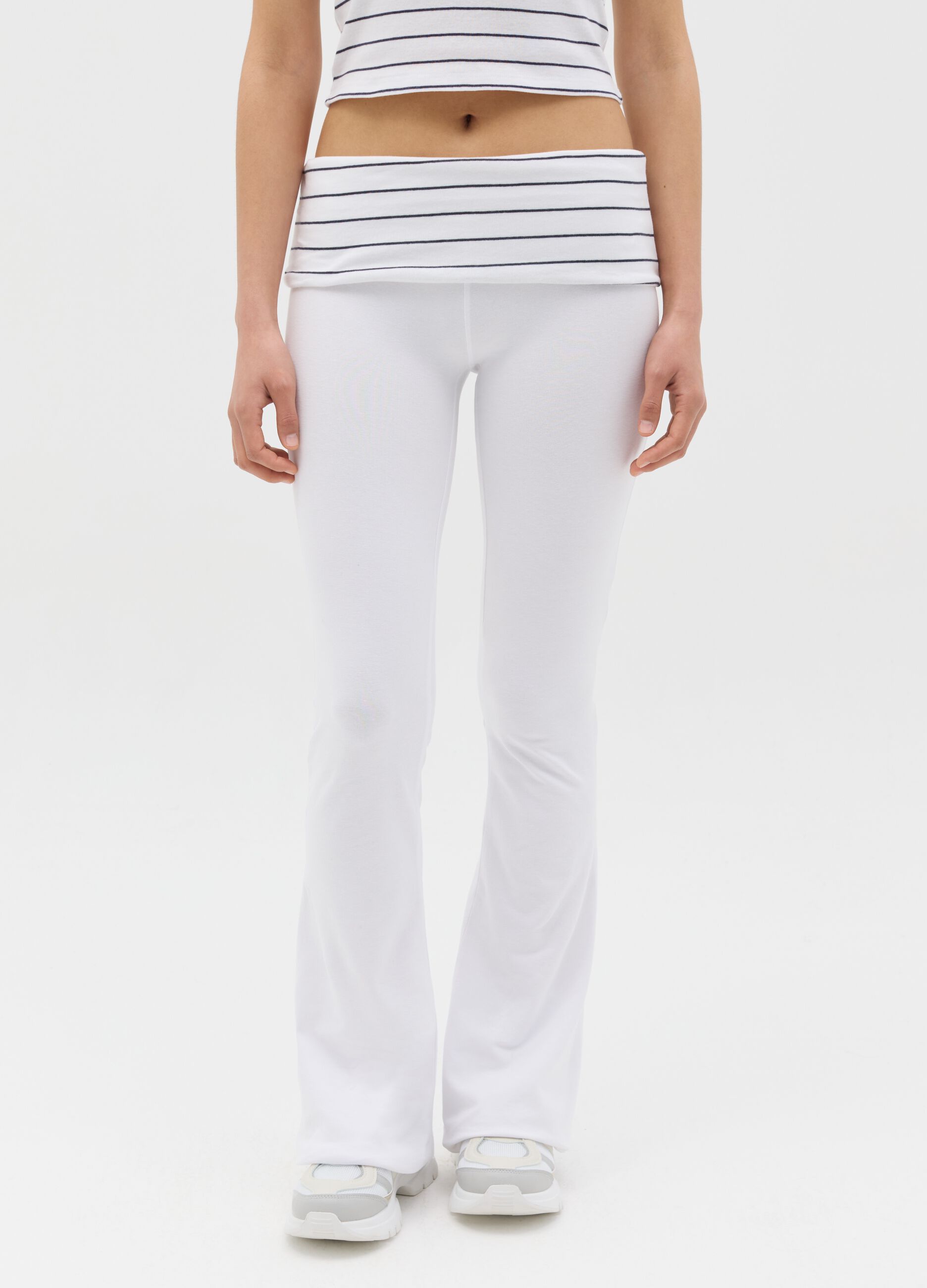 White flare-fit leggings with striped fold at the waist