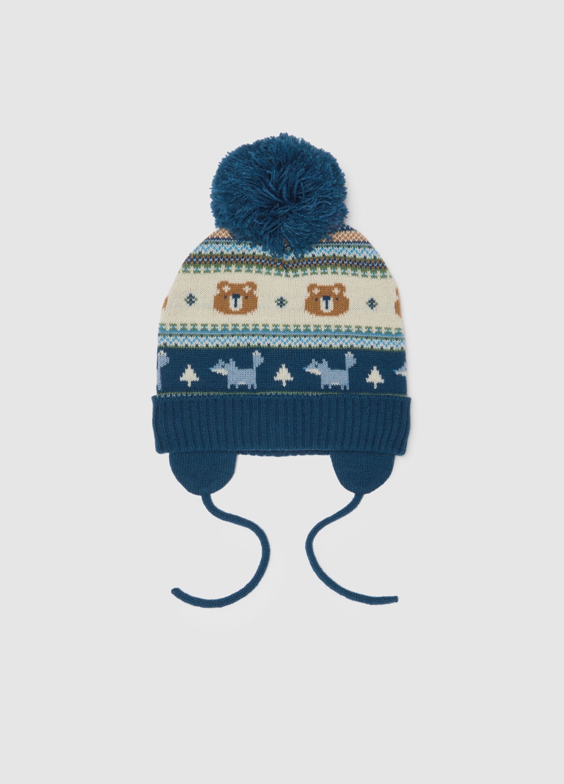 Blue hat with pom pom