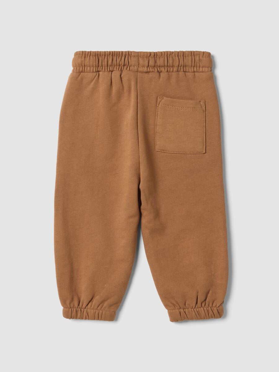 Pantaloni jogger marroni in puro cotone over fit con stampa animaletto_1