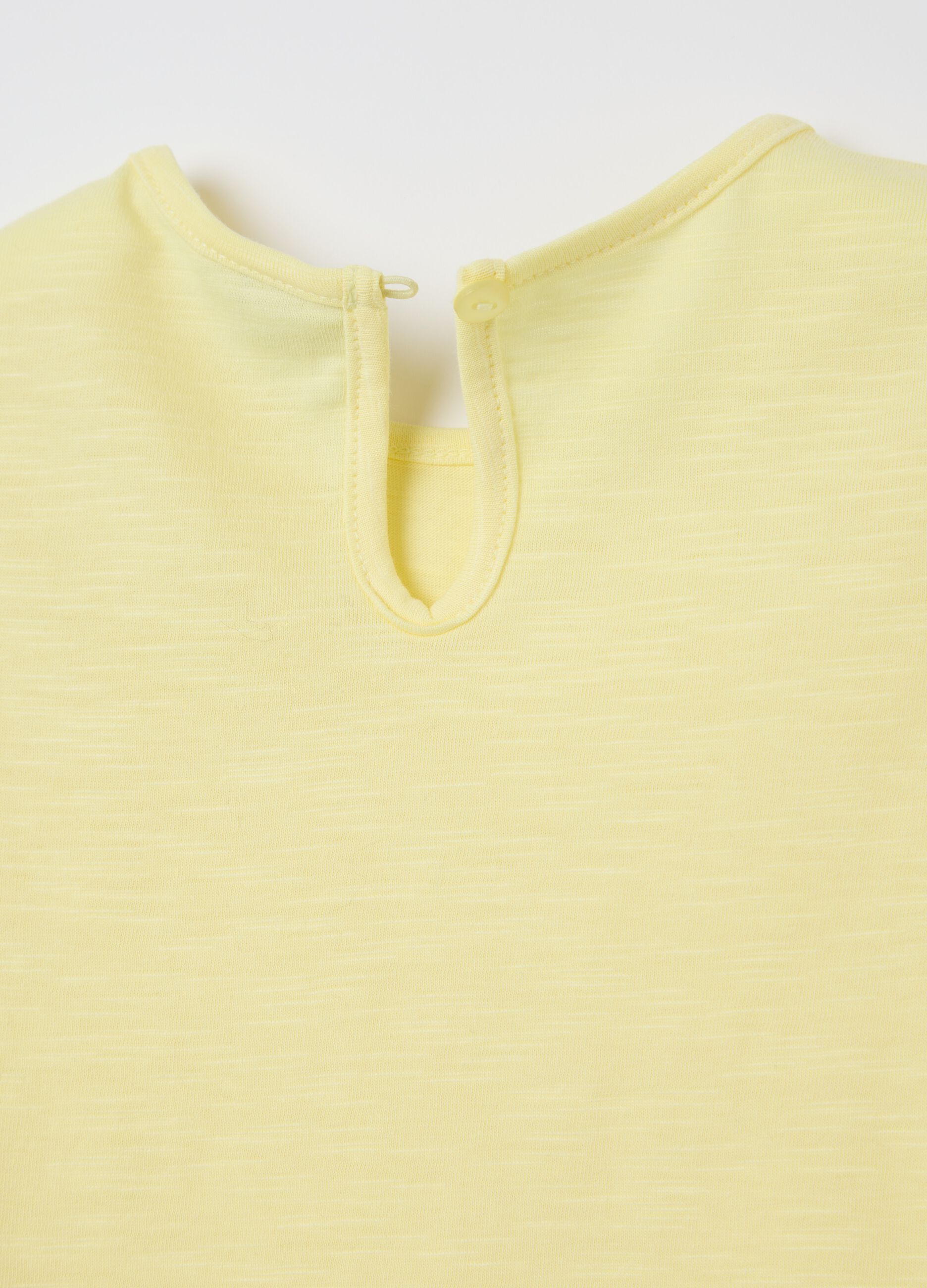Yellow cotton T-shirt with crochet flowers