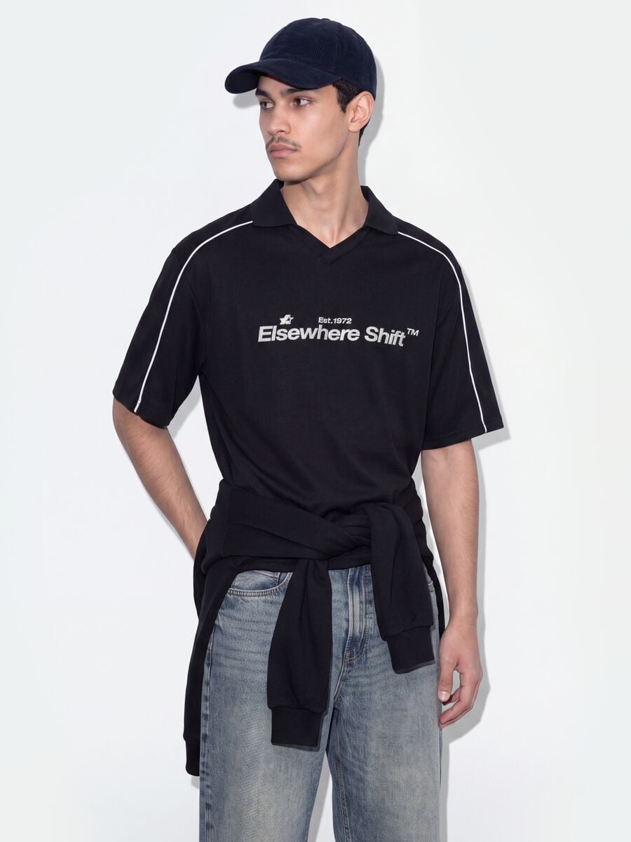 Polo nera in puro cotone over fit a maniche corte over fit_0