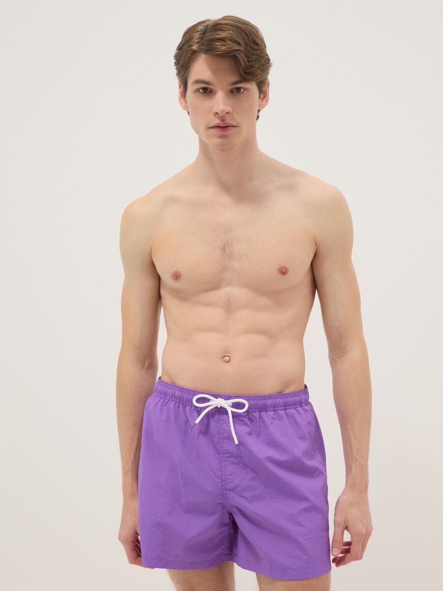 Purple swim shorts with elasticated waistband_0