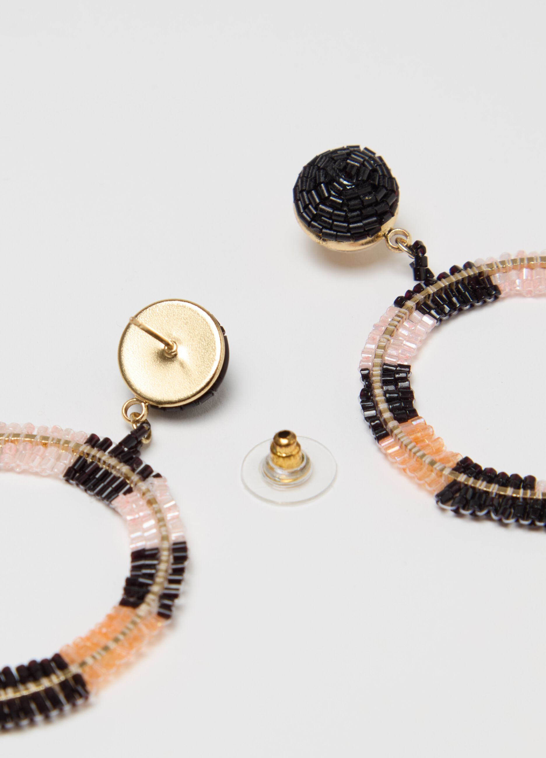 Earrings with beads and circle pendant